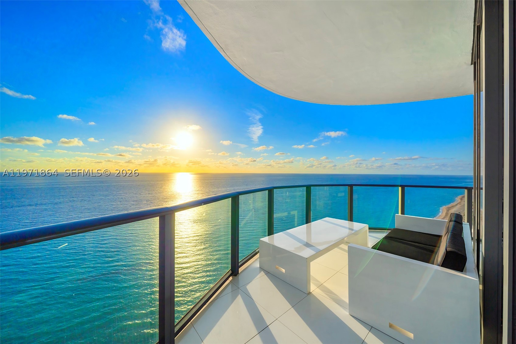 Welcome to an extraordinary expression of oceanfront living on Level 30, where privacy, scale, and design converge in this full-floor glass masterpiece spanning over 7,100 SF of seamless indoor-outdoor lavish living. Completely reimagined with no compromise, the residence is inspired by the timeless aesthetic of internationally renowned Dutch designer, Jan des Bouvrie, embodying architectural clarity against a backdrop of endless sea and sky. Sweeping 360° panoramas unfold from sunrise over the Atlantic to golden sunsets across the skyline. The oceanfront primary suite is a sanctuary of serenity, offering dual spa-inspired Travertine baths, a sculptural floating soaking tub overlooking the Atlantic and a midnight kitchen. Solid European white oak floors, finished in a luminous white glaze, flow seamlessly throughout. These true solid hardwood planks provide remarkable depth, durability, and a refined natural grain, enhancing the residence’s gallery-like ambiance. Grand entertaining spaces include a double formal salon, formal dining room, and media room, all framed by floor-to-ceiling glass, capturing every horizon. The chef’s kitchen pairs precision performance with artistry, featuring Miele appliances and custom-crafted Italian cabinetry. Residents enjoy white-glove services and true five-star amenities including a private beach club, spa, cabanas, fitness center, wine cellar, business center, and child's play area.