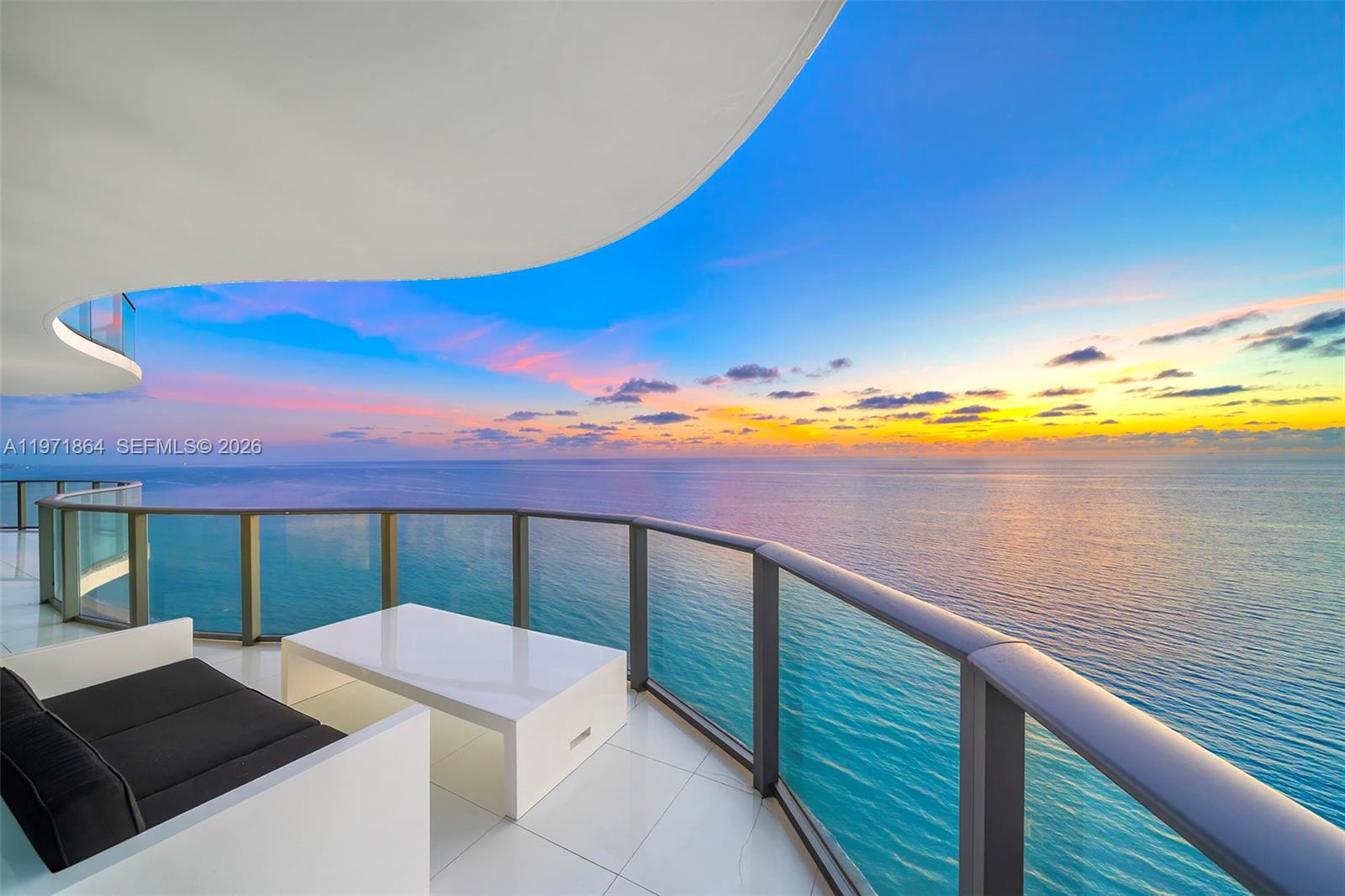 Welcome to an extraordinary expression of oceanfront living on Level 30, where privacy, scale, and design converge in this full-floor glass masterpiece spanning over 7,100 SF of seamless indoor-outdoor lavish living. Completely reimagined with no compromise, the residence is inspired by the timeless aesthetic of internationally renowned Dutch designer, Jan des Bouvrie, embodying architectural clarity against a backdrop of endless sea and sky. Sweeping 360° panoramas unfold from sunrise over the Atlantic to golden sunsets across the skyline. The oceanfront primary suite is a sanctuary of serenity, offering dual spa-inspired Travertine baths, a sculptural floating soaking tub overlooking the Atlantic and a midnight kitchen. Solid European white oak floors, finished in a luminous white glaze, flow seamlessly throughout. These true solid hardwood planks provide remarkable depth, durability, and a refined natural grain, enhancing the residence’s gallery-like ambiance. Grand entertaining spaces include a double formal salon, formal dining room, and media room, all framed by floor-to-ceiling glass, capturing every horizon. The chef’s kitchen pairs precision performance with artistry, featuring Miele appliances and custom-crafted Italian cabinetry. Residents enjoy white-glove services and true five-star amenities including a private beach club, spa, cabanas, fitness center, wine cellar, business center, and child's play area.