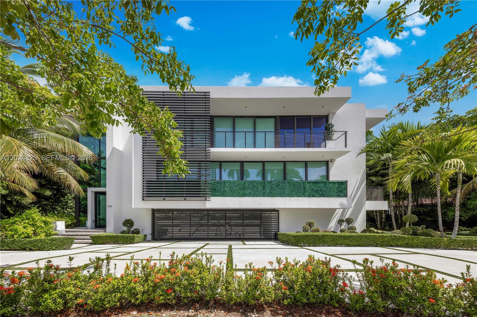 A turnkey modern masterpiece by award-winning architect Ralph Choeff, located on the coveted guard-gated Hibiscus Island. Newly completed, this residence impresses with a dramatic 20-foot glass foyer, floating staircase, and wide-plank white oak floors. Natural light fills the open-concept layout, seamlessly blending indoor and outdoor living. The sleek MiaCucina kitchen is equipped with Wolf and Sub-Zero appliances, while additional highlights include an Apple smart home system, private elevator, gym, sauna, resort-style pool, and expansive entertaining spaces designed for elevated comfort and ease.

The luxurious primary suite features dual ensuite baths and custom walk-in closets, while the rooftop terrace captures breathtaking 360-degree views of the Miami skyline. This fully turnkey residence offers exceptional value on the prestigious Hibiscus, Palm, and Star Islands, where residents enjoy exclusive island amenities including tennis courts, basketball courts, and a children’s playground. Ideally located just five minutes from Brickell, Downtown Miami, Edgewater, and South Beach, this home combines privacy, prestige, and convenience within one of Miami Beach’s most desirable enclaves.
