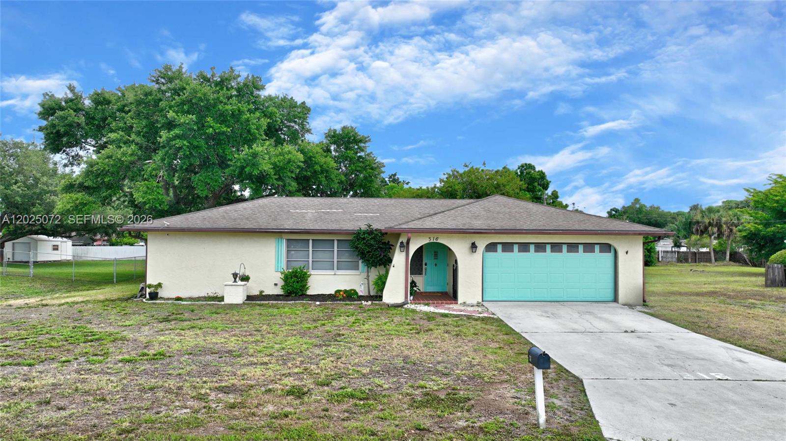 Spacious and well-maintained 3-bedroom, 2-bath home situated on a generous half-acre lot in a convenient central location with city water and sewer services. The attached garage has been converted into a versatile fourth bedroom with its own private side entrance, offering flexibility for guests, a home office, or rental potential — and can easily be converted back into a garage if desired. Relax in the screened and covered back porch overlooking the expansive backyard, complete with a fire pit, storage shed, and an impressive detached two-car garage featuring air conditioning and electric — perfect for a workshop, hobby space, or ultimate mancave.This property offers space, functionality, and endless possibilities both inside and out!
