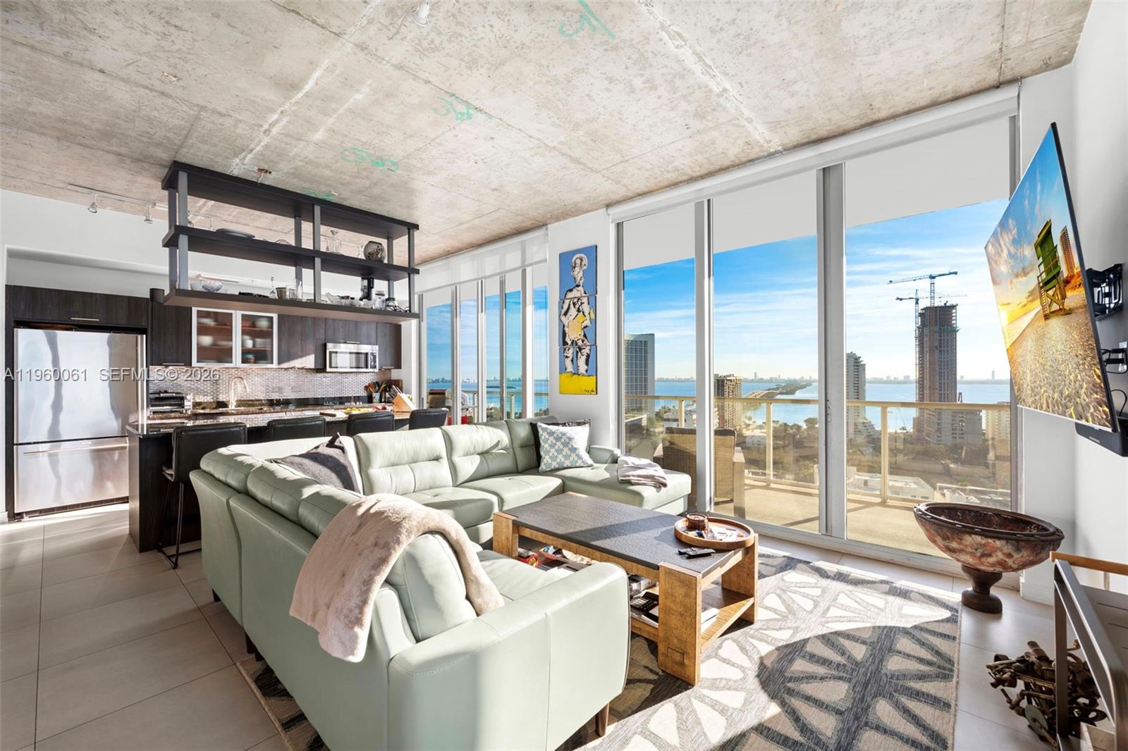 An exceptional residence in the heart of Midtown, this spacious two-bedroom, two-and-a-half-bathroom home offers 1,181 square feet of thoughtfully designed interior space complemented by an expansive 600-square-foot wraparound balcony—ideal for indoor-outdoor living and entertaining.

Situated just one block from the Design District, the residence enjoys an unbeatable location with walking-distance access to world-class shopping, dining, and wellness. Every major gym concept is moments away, as is Pura Vida Café and Midtown’s most sought-after lifestyle conveniences.

The well-proportioned layout features an open living and dining area, generous bedrooms with en-suite bathrooms, and a seamless flow to the oversized balcony, creating a true extension of the living space. A powder room adds both functionality and privacy for guests.

Located in one of Midtown’s premier buildings, this residence offers the perfect balance of sophistication, comfort, and urban energy—ideal as a primary home or refined pied-à-terre in one of Miami’s most dynamic neighborhoods.