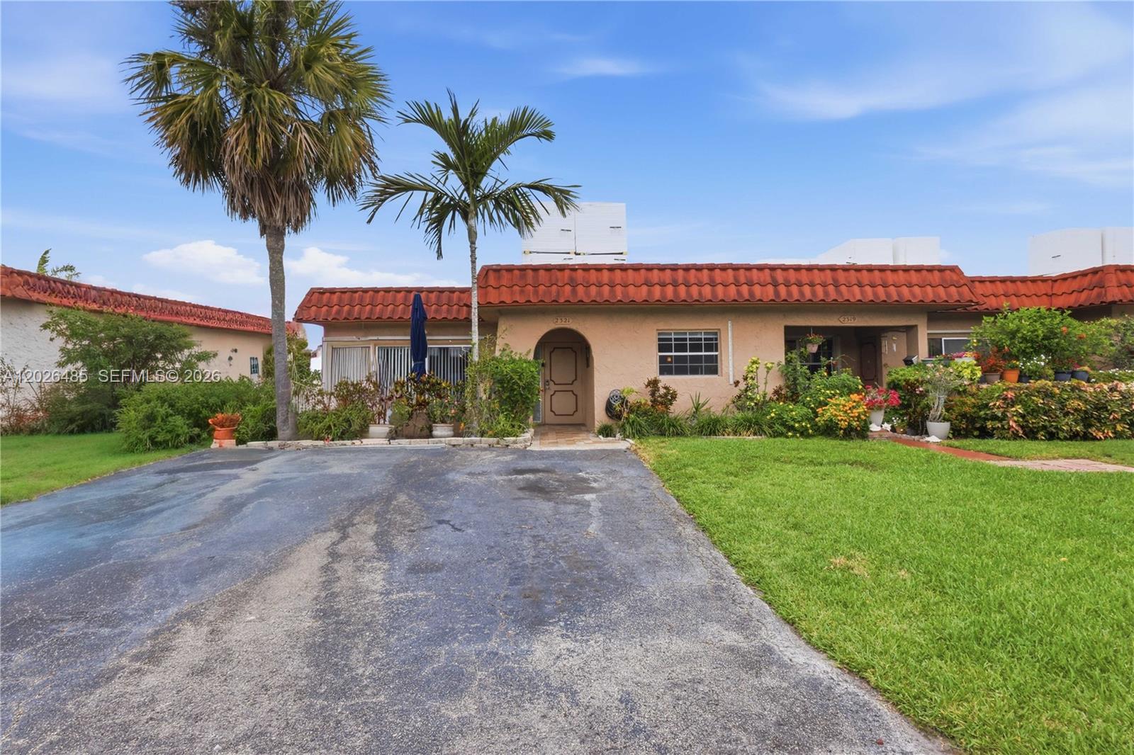 Exceptional Corner Villa with Private Atrium Oasis in North Lauderdale. Welcome to this beautifully maintained, single-story corner villa offering the ultimate blend of comfort, privacy, and classic South Florida charm. Located in a vibrant and highly desirable 55+ community, this bright and spacious 2-bedroom, 2-bathroom residence boasts outstanding curb appeal and a thoughtfully designed layout filled with abundant natural light. Serving as a peaceful retreat, the heart of the home highlights a seamless indoor-outdoor flow. It features a welcoming front porch and an expansive, private screened atrium/courtyard accessible from both bedrooms and the main living area—ideal for morning coffee or evening relaxation. The property also features an updated kitchen equipped with stainless steel appliances, a separate dining area, a large family room, and a dedicated laundry room. Key Features Include: Spacious Layout, Open-concept living areas perfect for entertaining, paired with elegant flooring throughout. Primary Suite: Features a generous walk-in closet, a large en-suite bathroom, and direct atrium access. Perfectly situated in the heart of North Lauderdale, this villa is move-in ready and designed to elevate your lifestyle. Schedule your private tour today!
