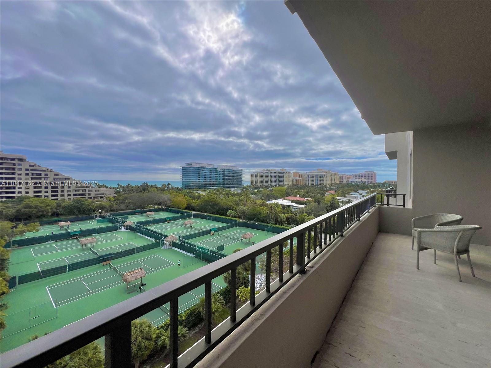 Stunning panoramic ocean views from this spacious 2/2 apt, overlooking tennis courts. custom built-in wood cabinets throughout, marble floors, beautiful remodelled kitchen. huge master bedroom leading to large bath, separate shower and custom closets. feel the ocean breezes from your balcony and enjoy the newly renovated pool, gym and lobby areas, designed by world renowned architect willy borroto. apt comes with 2 convenient parking spaces.