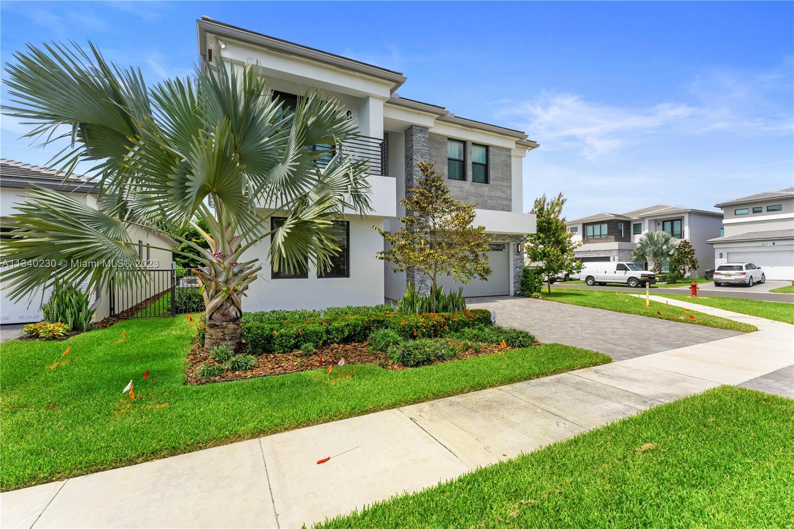Gorgeous corner 5 bedrooms and 7 baths Polynesia Model located at Boca's newest contemporary community of Lotus. This professionally designed home offers so many upgrades from a gorgeous modern kitchen including an oversized quartz island, gas stove, double oven, upgraded modern kitchen cabinets, professional design woodwork surrounding the kitchen cabinets, and a beautiful vertical garden, to the gorgeous custom carpentry in the TV room. The formal living room was converted into a more useful entertaining room with a pool table, a custom carpentry wall with LED lights, and a phenomenal glass wine room under the stairs. Upgraded porcelain floors, impact windows, and upgraded glass staircase. Fenced backyard with plenty of space for a pool. Resort-style amenities and rated A schools.