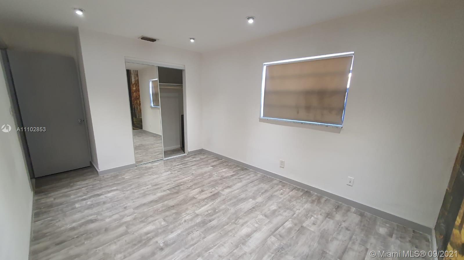 CBS home with big wooden deck in fenced backyard, central AC, ceiling fans, tile floors, grass yard, stainless steel appliances, big storage room, full laundry room, recessed lighting some rooms and more.