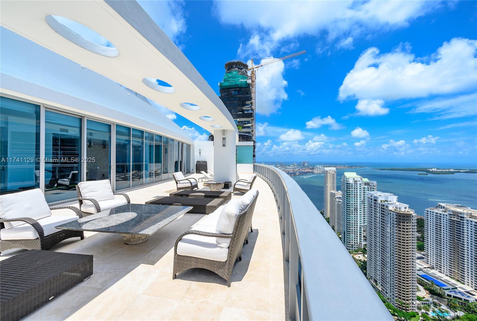 ONE OF A KIND PENTHOUSE unit w an expansive terrace featuring private jacuzzi, interior elevator & spectacular unobstructed expansive views. Marble floors throughout the living spaces & carpeting in the bedrooms. All bedrooms are en suite. Kitchen is fully equipped w Miele appliances, 2 wall ovens, 2 dishwashers, built in coffee maker, Sub Zero refrigerator & freezer & marble countertops. Large master suite offers 2 master closets + a linen closet. 2nd floor features a bar area w ice maker, dishwasher & a 500 bottle wine cellar. Service quarters includes laundry room. This unit has 4 assigned parking spaces. The Epic is a full service building w heated pools, state of the art gym, bar, meeting and children rooms, restaurants, 24 hours security & concierge.