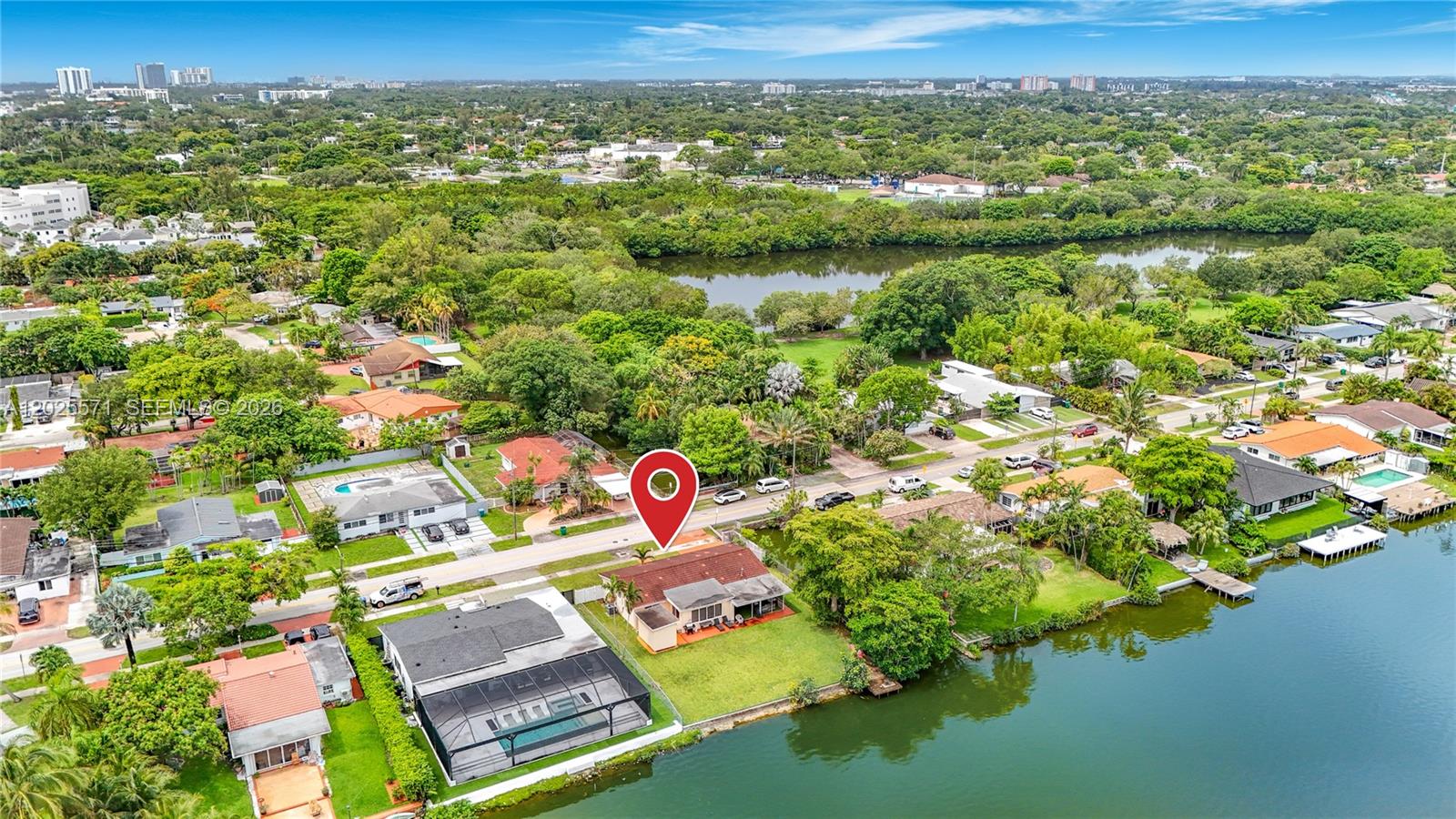 Rare waterfront investment opportunity in a gated community with expansive lake views and highly desirable double-sided water frontage — a unique feature owned by only 4 homes on the entire lake. This 3-bedroom, 2-bathroom home offers 1,411 sq/ft of living space on an oversized 11,400 sq/ft lot (95 ft x 120 ft), creating exceptional potential for investors, developers, or end-users.

The property offers multiple value-add opportunities including renovation, expansion, redevelopment, or use as a high-demand seasonal or Airbnb-style rental. The jet ski and small motor boat-friendly lake, combined with excellent fishing and waterfront lifestyle appeal, make this a standout asset with strong long-term upside.

Centrally located in a highly walkable area near schools, places of worship, shopping, dining, and major conveniences. Easy to show.