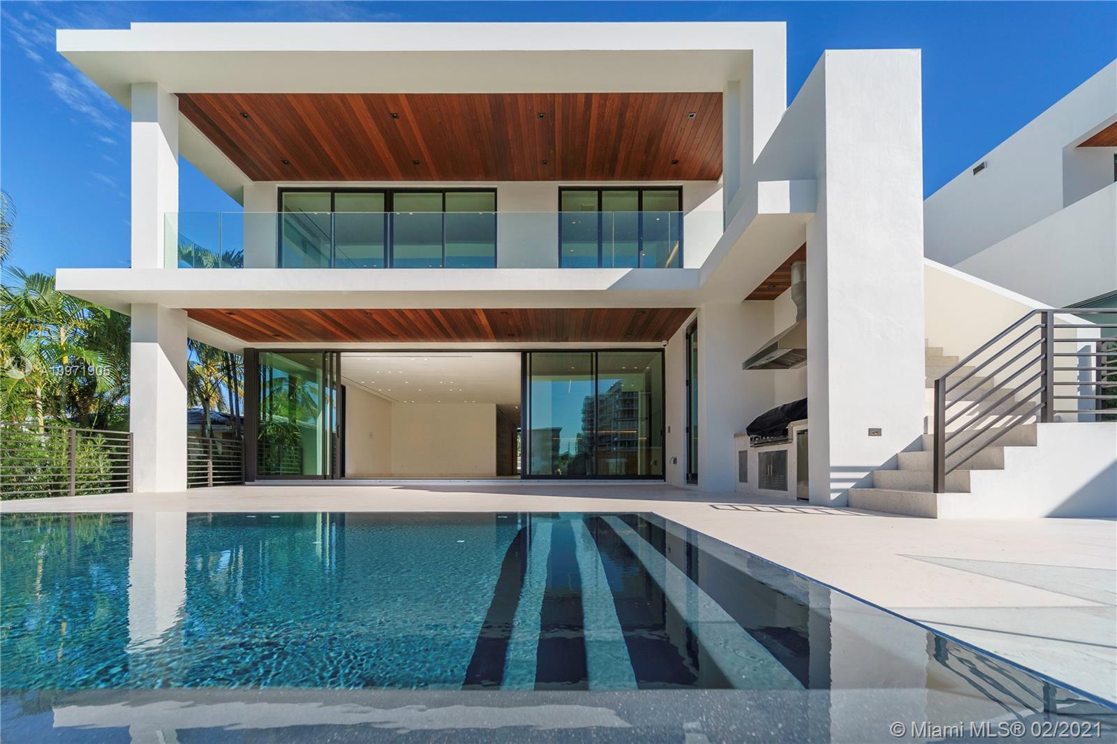 Brand new & just completed one-of-a-kind home in Surfside. New Construction with 50' wide waterfront. Smart home with 6,800 SF of interior space, 10’ foot ceilings, 7 BR 8.5 BA, rooftop terrace with 360-degree views & 2,000 SF of outdoor terraces. Upon entering, the 25’ Entranceway, natural light and bay views encapsulate the living quarters, highlighting limestone flooring, custom millwork, and a floating staircase. Enjoy formal dining, & an eat-in kitchen with Wolf & Sub-zero appliances. The back of the home showcases a custom 10-foot sliding glass door, an infinity-edge pool, outdoor kitchen, & cabana bathroom. Upstairs, the Master Suite encompasses the entire back of the home, & another 4 large en-suite bedrooms. Full house generator & 2 car garage.