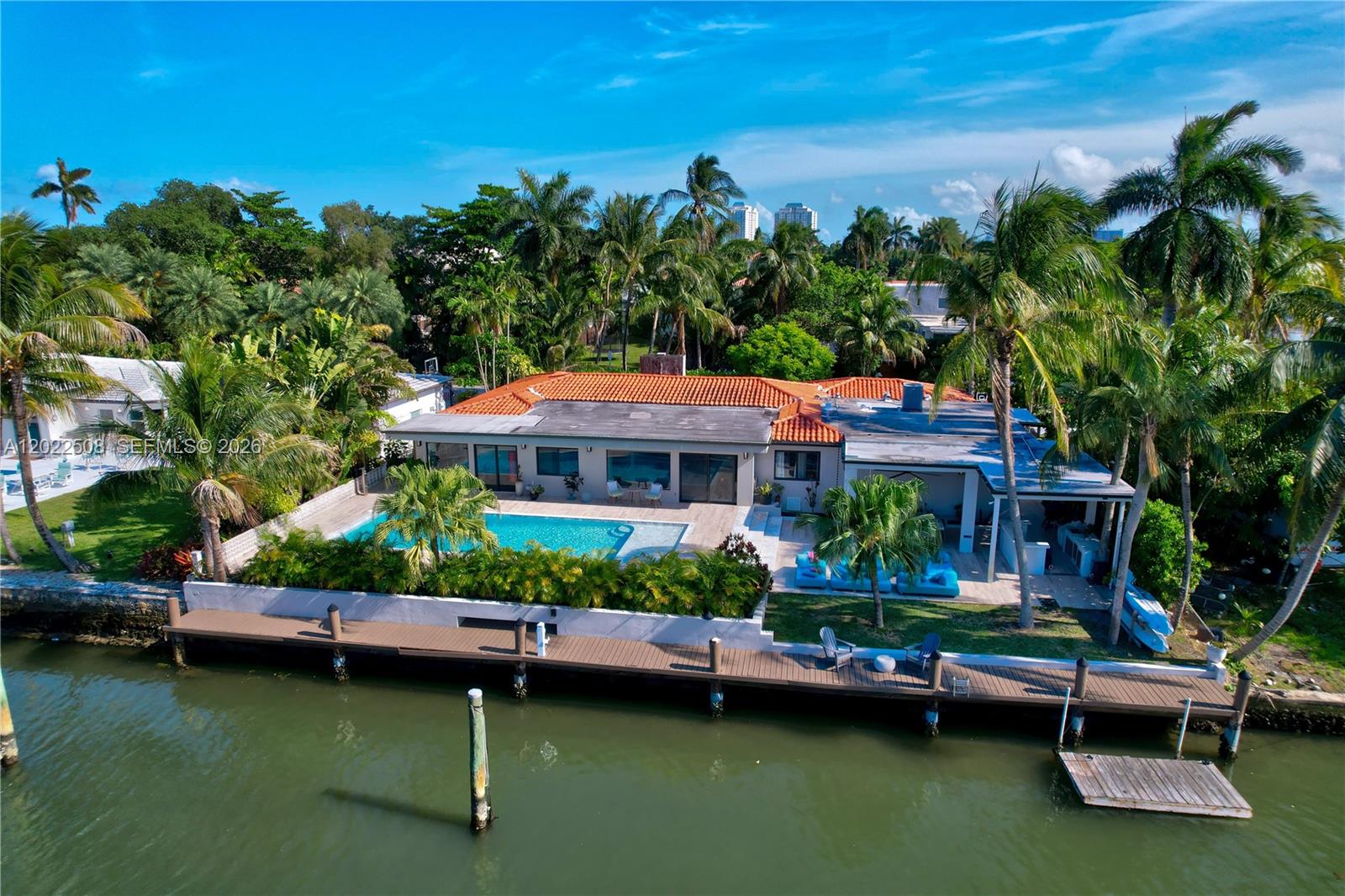 Located in one of Miami’s most coveted waterfront neighborhoods, this stunning fully furnished residence offers the ultimate luxury rental experience just in time for the World Cup. Blending sophisticated design with effortless indoor-outdoor living, this exceptional waterfront home is the perfect seasonal retreat for those seeking privacy, comfort, and unforgettable Miami vibes. This beautifully appointed fiver-bedroom, five-bathroom single-family home features spacious living areas filled with natural light, designer furnishings, and seamless views of the water. The open-concept layout was designed for entertaining, with elegant living and dining spaces that flow effortlessly into the outdoor oasis. Enjoy a true resort-style lifestyle with expansive waterfront views, multiple lounging areas, and serene outdoor spaces ideal for relaxing after a day in the city or hosting friends and family during the World Cup festivities. Whether you’re enjoying morning coffee by the water, sunset cocktails, or dining al fresco under the Miami sky, every detail of this home was curated for elevated living.
The fully equipped chef’s kitchen, generously sized bedrooms, and spa-inspired bathrooms provide both luxury and functionality, while the turnkey furnished design allows for an effortless move-in experience. Located just minutes from Miami’s top dining, shopping, nightlife, beaches, and major event venues, this home offers the perfect balance of tranquility and accessibility.