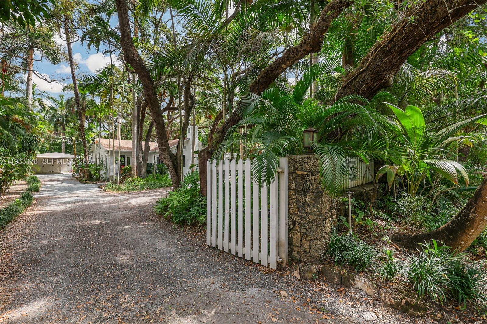 Situated on one of North Coconut Grove’s most coveted residential streets, this property sits on an extraordinary 20,000 SF lot in the heart of the Grove, presenting a rare opportunity to enjoy the existing residence, expand, or create a new custom estate. Mature tropical landscaping and a lush natural canopy create a private, serene setting just moments from the parks, marinas, top schools, and CocoWalk. The existing 3-bedroom, 3-bath residence captures the character and charm long associated with classic Grove homes and has been thoughtfully updated for comfortable modern living. Light-filled interiors flow easily from the main living areas to inviting outdoor spaces. A screened wraparound porch and expansive patios provide ideal spaces for entertaining or relaxing while surrounded by greenery. With impact windows and doors and a recently updated roof, the home offers immediate livability and timeless appeal. Whether you choose to enjoy the home as it is, personalize and expand over time, or design a new custom residence, this exceptional property offers rare flexibility for both end users and developers. A truly special opportunity to secure a 20,000 SF homesite on one of North Coconut Grove’s premier streets.