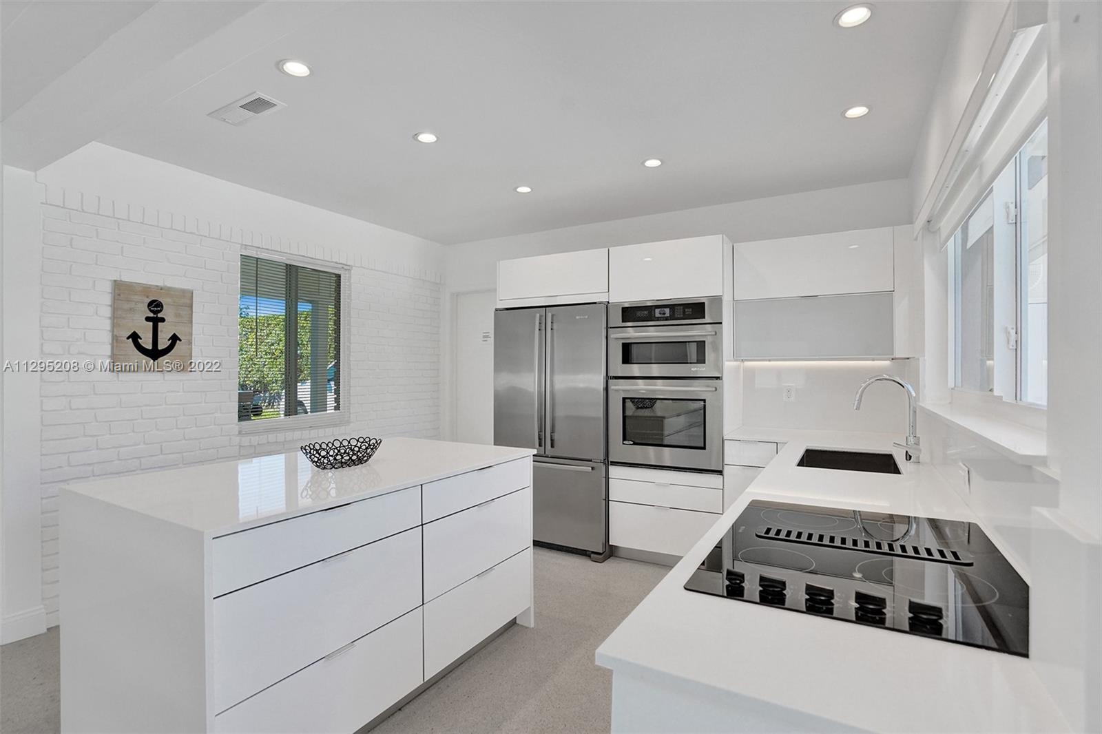 Welcome to your bright, open and airy not to mention fully-furnished beach house. Modern with a gracious entry located in Hillsboro Shores “best kept secret” of a neighborhood. Imagine being able to easily access the beach exclusively gated only allowing private access. Beautiful kitchen with Caesar Stone countertops, Jenn-air stainless steel appliances. Open concept, featuring rare and original white Terrazzo floors, vaulted ceiling perfect for entertaining. Outside you will enjoy the nice jacuzzi with beautiful lounge, dining and BBQ area. Impact windows throughout including all doors and garage door. Brand new AC unit. Back-up Generator. Very close to the new Pompano Beach Fishing Pier with cute cafes and shops. Private beach has membership fee Not mandatory Room for a pool see plans