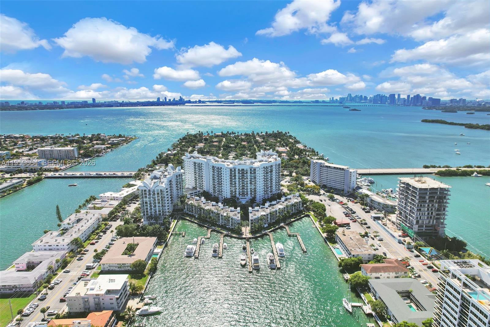 Experience luxurious island living at 7910 Harbor Island Dr #1103 in the desirable 360 Condominium of North Bay Village. This bright 11th-floor unit offers stunning bay and city skyline views, an open layout, and a kitchen with granite countertops and new appliances, including a Smart Samsung freezer, Samsung stove, microwave, and dishwasher. The spacious primary suite features a walk-in closet and a spa-style bathroom with dual sinks, soaking tub, and separate glass shower. A private balcony provides the perfect spot to enjoy serene waterfront views. Move-in ready and assessment fully paid by seller.

Building B features beautifully renovated lobbies and hallways, adding an elegant touch to the community. Residents enjoy resort-style amenities including two heated pools, a fitness center, sauna, clubhouse, marina access, plenty of guest parking, complimentary valet, and a gated entrance with manned guard house and 24-hour security patrol. HOA dues include cable, internet, security, and common-area maintenance, offering excellent value and peace of mind.

Ideally located minutes from Miami Beach, Midtown, the Design District, top dining, shopping, and major highways, this residence combines comfort, convenience, and breathtaking views—an exceptional opportunity in one of North Bay Village’s most sought-after waterfront communities.