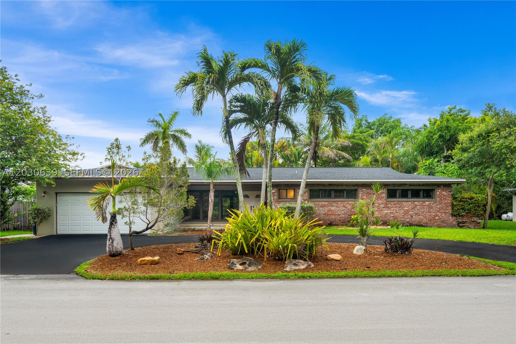 Experience the charm and tranquility of canal-front living in this spacious South Miami home. Situated on a 9,972-square-foot waterfront lot, this 4-bedroom, 2-bath residence offers approximately 2,150 square feet of living space, a two-car garage, private pool, and an exceptional setting in one of South Miami's most desirable neighborhoods. The home features valuable updates, including a roof replaced in 2020, a new air conditioning system installed in 2025, a newer kitchen with granite countertops and stainless steel appliances, and a beautifully renovated primary suite bathroom. Spacious living and dining areas provide ample room for everyday living and entertaining, while large windows fill the home with natural light and showcase views of the pool, backyard, and tranquil canal. Step outside to enjoy your private outdoor retreat, where the sparkling pool and picturesque waterfront setting create the perfect backdrop for relaxing and entertaining. With its desirable floor plan, waterfront location, and major improvements already completed, this property presents an outstanding opportunity to further modernize and customize the home to suit your vision. Ideally located near top-rated schools, parks, shopping, dining, the University of Miami, Coral Gables, and major commuter routes, this exceptional property offers location, lifestyle, and long-term value.