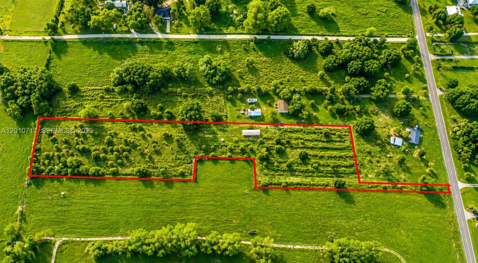 Now available-this beautiful 5.05-acre tract offers the perfect blend of privacy, space, and convenience in one of LaBelle's most desirable areas. Tucked away behind an existing residence on a 1+ acre parcel, this secluded homesite provides peaceful setting with the added benefit of a deeded roadway for access. The acreage is cleared and dotted with scattered trees, creating a picturesque canvas ready for your dream home. Zone Agricultural Residential, this property allows for animals, making it ideal for those seeking a mini-farm, equestrian setup, or a true country lifestyle. A 20' x 60' steal equipment carport is already in place-perfect for storing machinery, RV's, boats, or building materials while you develop the property. Located just west of town near the Fort Denaud Bridge, this property offers easy access to LaBelle, Fort Myers, and Interstate 75, making commuting and travel convenient while still enjoying the tranquility of country living. Please note: Property will require installation of a well and septic system. Don't miss this opportunity to own a private slice of Southwest Florida with room to grow!