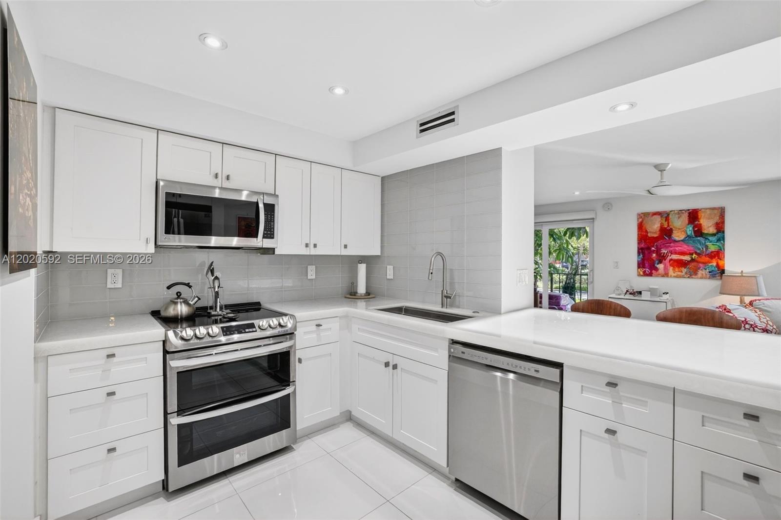 Welcome to Top of the Mile and this ultra renovated 1st floor, 2 bed, 2 bath condo on A1A. Prime location, 1 block from the sand in Lauderdale-by-the-sea, across the street from restaurants, shops, grocery. No expense spared, Fully renovated designer kitchen w/ Ash white glass Crystal countertops w/ Lumiron LED backlighting, new LG Appliances (2021), wine fridge. Porcelain Floors, Hunter Douglas windows Treatments, Smooth ceilings, renovated Baths, LED mirrors. All Impact windows & doors, washer & Dryer in unit, a gorgeous sleek modern condo for you. AC (2018), Water heater (2021) 40 year & Concrete restoration complete, budget has reserves, great for full time residents, snowbirds, beach lovers, can rent once per year for income while you are not using it too. Secure Garage & Building, custom $4k storage unit, only 64 units. Updated Fitness center & pool. All ages welcome. Conventional Financing available. 2nd bed was opened up to make a large living space with wide open floor plan perfect for office / loft style, can easily be converted back.
