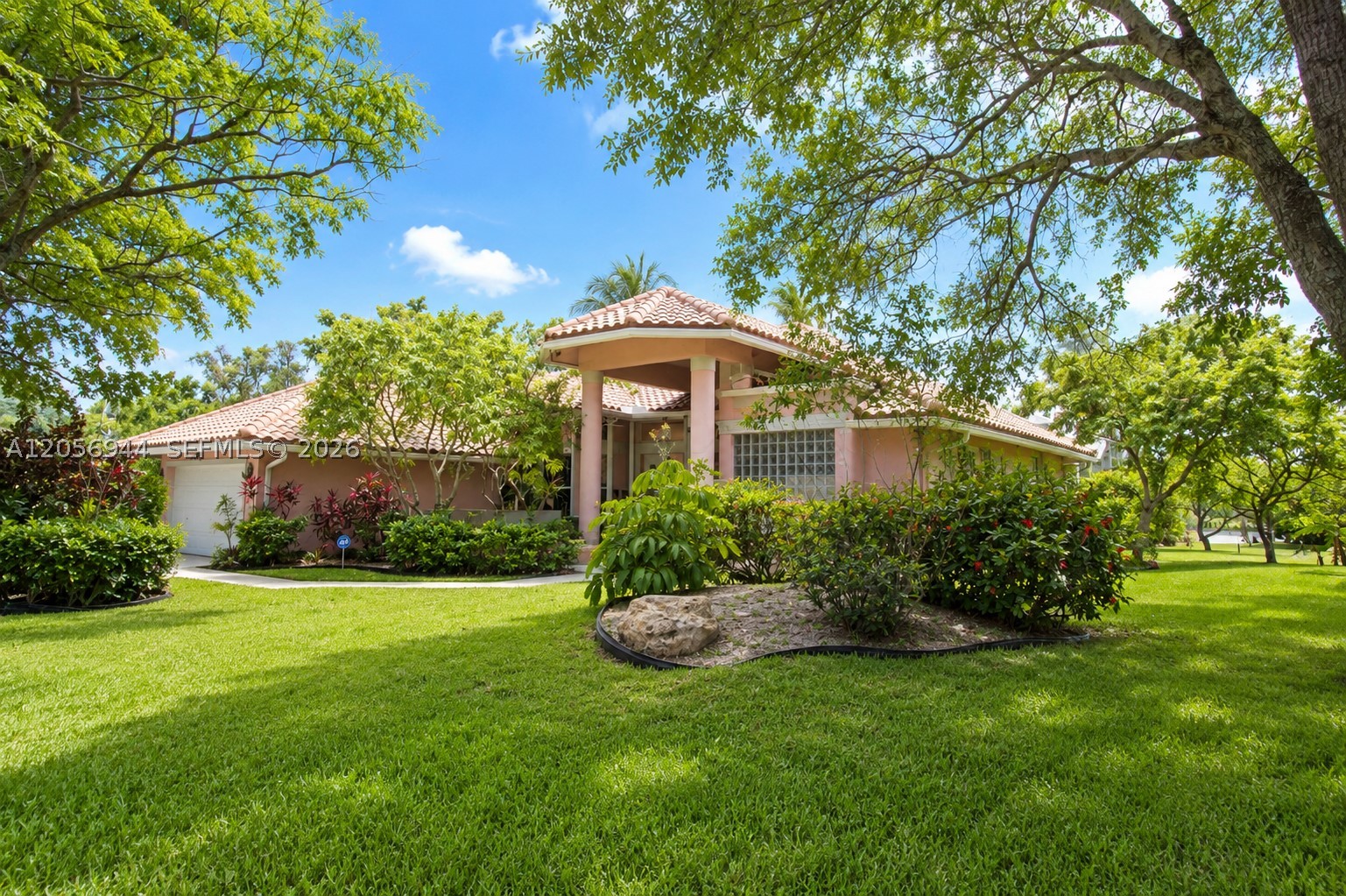 Welcome to this beautifully maintained, spacious home in the heart of Coral Springs, offering a desirable split-bedroom floor plan and peaceful water views overlooking the pool. From the moment you approach the property, you're greeted by a grand entrance with a welcoming seating area, creating an elegant first impression. Designed for comfortable living and entertaining, this home features generous living spaces filled with natural light and a seamless connection to the outdoor oasis. Relax by the pool while enjoying tranquil water views, or stroll through the property surrounded by mature fruit trees that add both beauty and privacy. Whether you're looking for room to spread out or the perfect place to entertain family and friends, this home offers the best of South Florida living. An incredible opportunity to own a spacious home in one of Coral Springs' most desirable communities at an exceptional value. Schedule your private showing today!