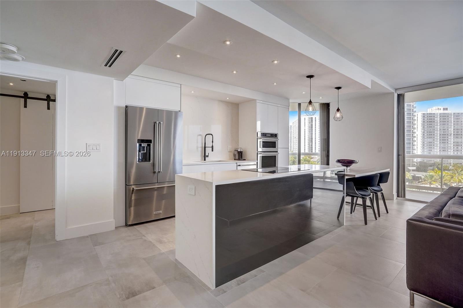 Spectacular Fully Remodeled 2-Bedroom, 2-Bath Condo with Panoramic Water, Golf & City Views: Seller Pays Special Assessment!

Welcome to the finest 2/2 residence in the building. This stunningly remodeled condo delivers luxury living at its best, showcasing sweeping views of shimmering water, lush golf greens, and the vibrant city skyline. Bathed in natural light, the open-concept layout is enhanced by premium finishes and thoughtful design throughout.

The chef-inspired kitchen is a true showpiece, featuring top-of-the-line appliances, custom cabinetry, and sleek surfaces; perfect for both everyday living and entertaining. Expansive living and dining areas flow effortlessly, creating a refined yet inviting atmosphere.

Retreat to spacious bedrooms offering custom closets and spa-inspired bathrooms designed for comfort and relaxation. Every detail has been meticulously curated to blend modern elegance, functionality, and timeless style.

Unwind with breathtaking sunsets and sparkling city lights from your private sanctuary. Ideally located near houses of worship, upscale shopping, and A-rated schools, this move-in-ready home is an exceptional opportunity to enjoy luxury, location, and value—all in one remarkable residence.
