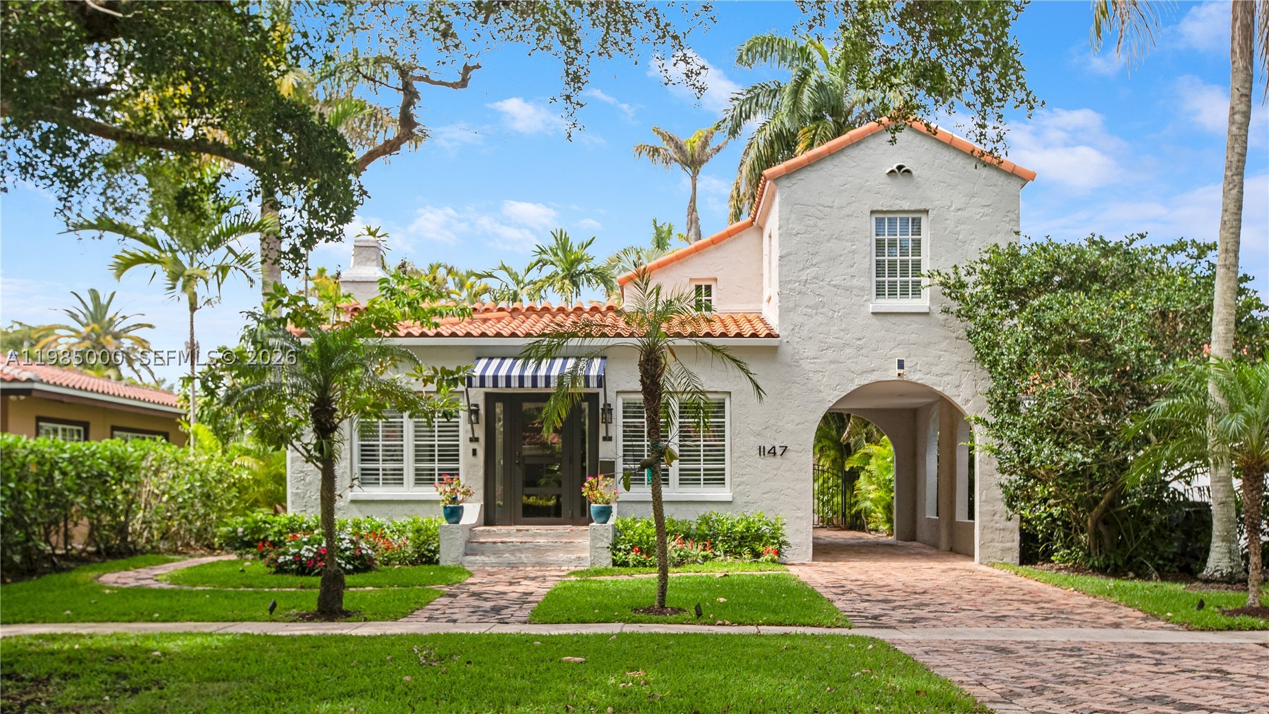Step into this rare Old Spanish gem in the heart of Coral Gables—beautifully restored to blend timeless architectural character with modern luxury. This recently renovated residence offers two spacious bedrooms and two full baths, plus a separate dedicated office with custom built-ins. The home also features an additional bright, inviting den with a custom Murphy bed, providing flexible living or an ideal space for overnight guests.

At the center of the home is a fully updated Mia Cucina kitchen featuring Sub-Zero refrigeration and Wolf appliances. The private upstairs primary suite includes vaulted ceilings, a walk-in closet, and a spa-inspired bath with a dual-head rain shower.

Outdoors, the property truly shines. A heated saltwater pool and spa are surrounded by lush, private landscaping, creating a serene retreat perfect for relaxation or entertaining. The residence also includes a Tesla Level 2 EV charger in the carport, compatible with both Tesla and non-Tesla electric vehicles.

Situated on an expansive lot, this home offers the perfect blend of historic charm, modern amenities, and exceptional outdoor living.