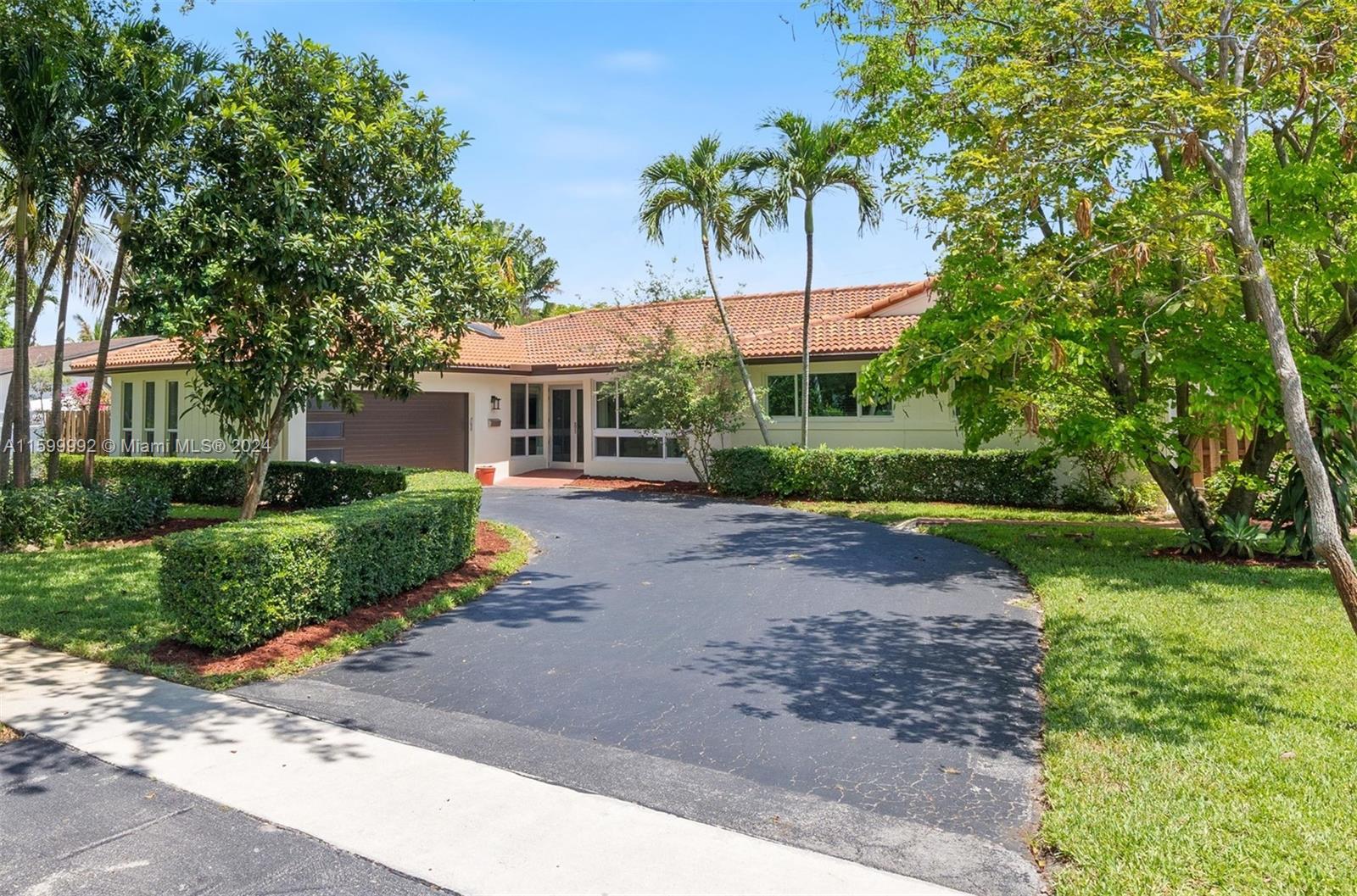 Nestled in the serene, tree-lined community of Plantation, this home offers a perfect blend of tranquility and convenience. The property boasts a spacious, lush backyard with a sparkling pool that promises countless days of relaxation and fun under the Florida sun. All impact windows ensure safety and peace of mind during stormy weather. Inside, the home is well-designed with a warm, inviting ambiance. A standout feature of this property is the versatile master bedroom that could be an in-law suite. With its private entrance, this space is perfect as a large master bedroom or can serve as a lucrative rental generating monthly income. Additionally, the location provides easy access to beautiful parks within walking distance, perfect for leisurely strolls and outdoor activities.