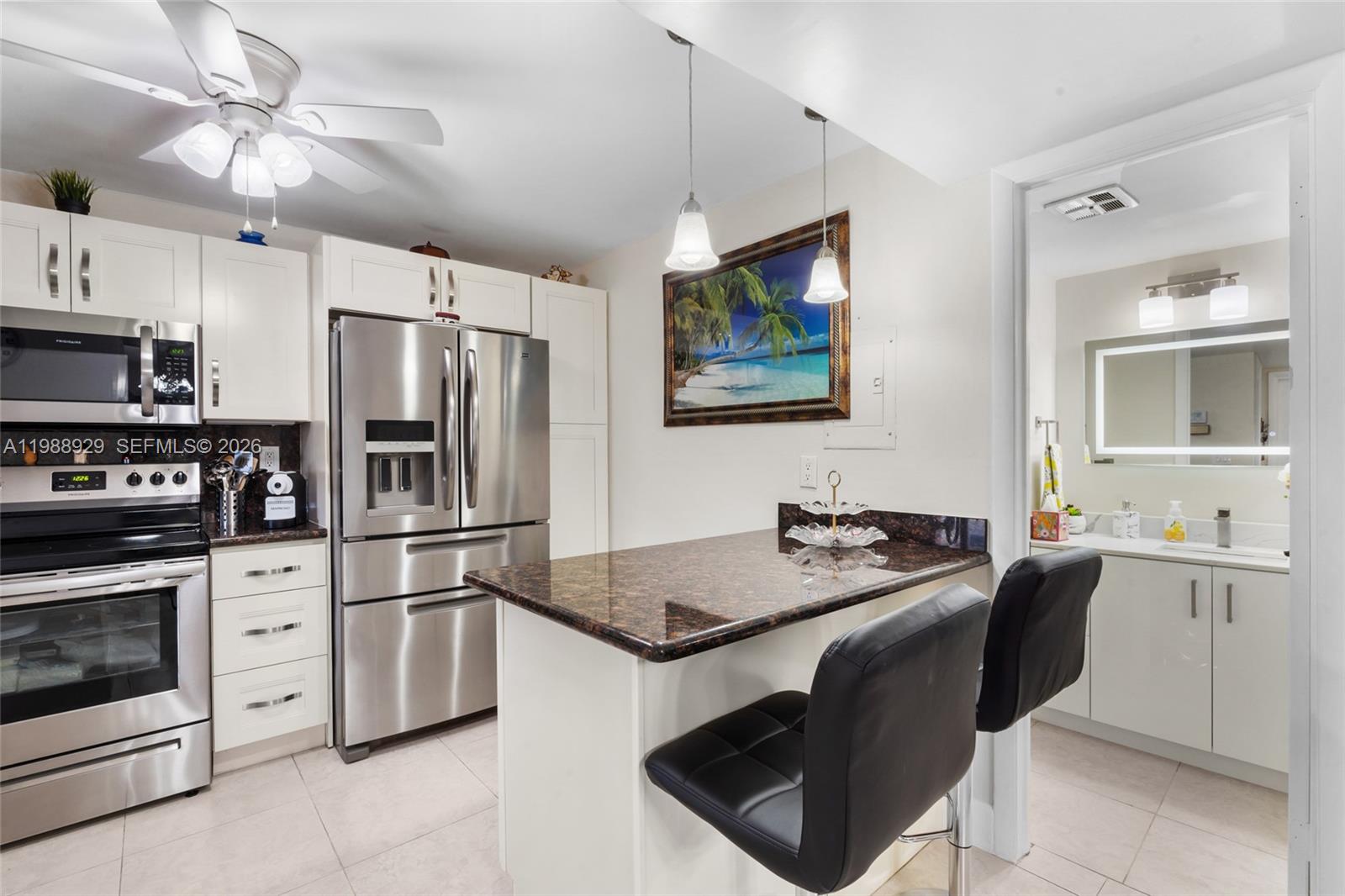 Welcome to this beautifully updated 1 bed/1.5 bath corner unit completely updated in the coveted Hollybrook Golf & Tennis Club. This unit is in pristine, move-in condition. This bright and spacious unit features impact windows/doors, tile floors, a brand-new AC, and an updated kitchen and bathroom. Located in sought-after Phase 2, the open floor plan includes a convenient Murphy bed for guests. Enjoy resort-style living with amenities like tennis courts, pools, theater, fitness center, free golf, billiards, courtesy bus, and a clubhouse—all in a guard-gated 55+ community. Assigned parking and plenty of guest spaces. Rec lease fully paid! All Special Assessments have been paid