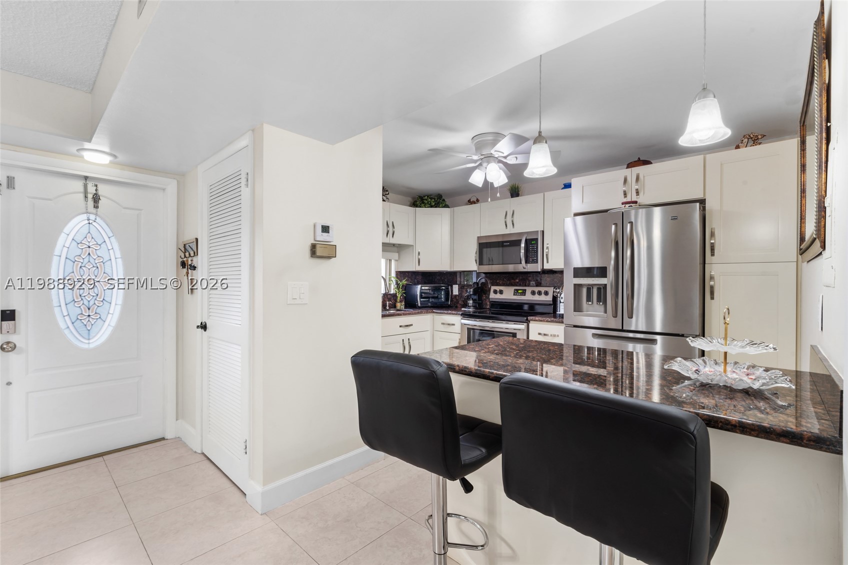 Welcome to this beautifully updated 1 bed/1.5 bath corner unit completely updated in the coveted Hollybrook Golf & Tennis Club. This unit is in pristine, move-in condition. This bright and spacious unit features impact windows/doors, tile floors, a brand-new AC, and an updated kitchen and bathroom. Located in sought-after Phase 2, the open floor plan includes a convenient Murphy bed for guests. Enjoy resort-style living with amenities like tennis courts, pools, theater, fitness center, free golf, billiards, courtesy bus, and a clubhouse—all in a guard-gated 55+ community. Assigned parking and plenty of guest spaces. Rec lease fully paid! All Special Assessments have been paid