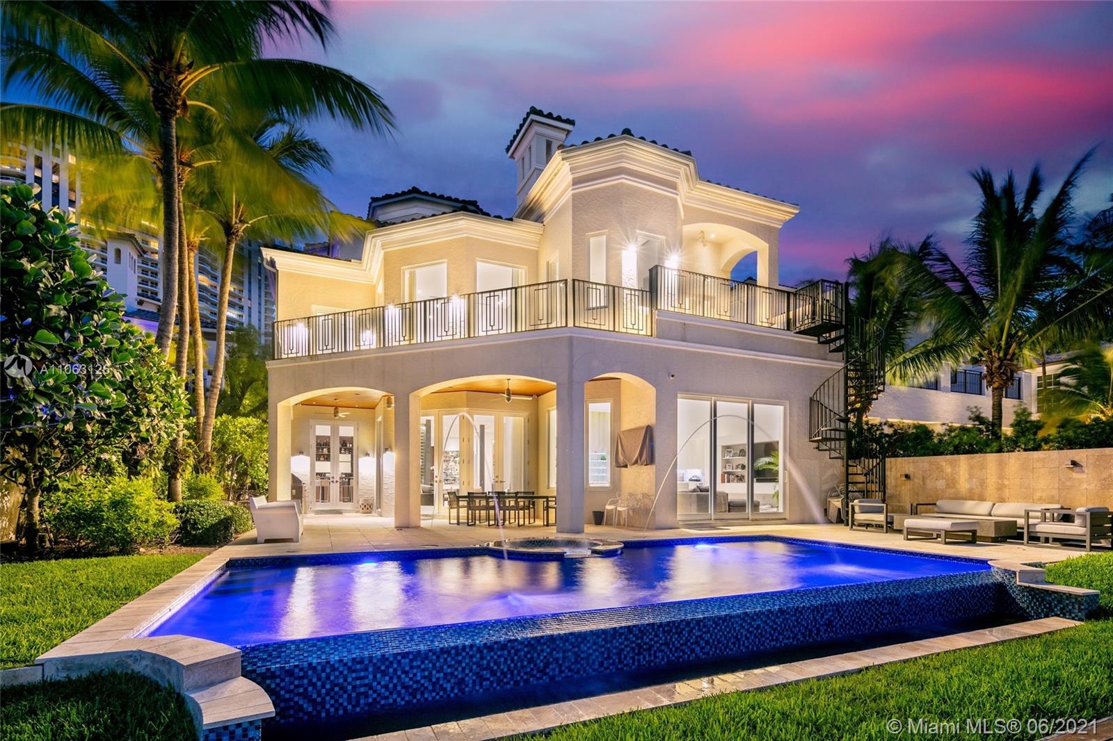 Three story modern masterpiece featuring 6BD/7BA in the exclusive Island Estates gated community. Provide endless entertainment, night or day, mingling and eating in your bar room, selecting the perfect wine pairings from state-of-the-art wine storage, or grab snacks to watch movies in the media room and end the day with a swim in infinity pool with spa. Complete with Waterworks furnishings, Toto toilets, impact glass, whole home generator, reverse osmosis water filtration, large chef's kitchen, 40 ft ceilings, private staff quarters and a separate guest house. Walk to your yacht docked at nearby Island Estates Marina which can hold a vessel up to 50 ft. Watch the sun rise over intracoastal waters while taking advantage of panoramic views which can also be seen in every room.
