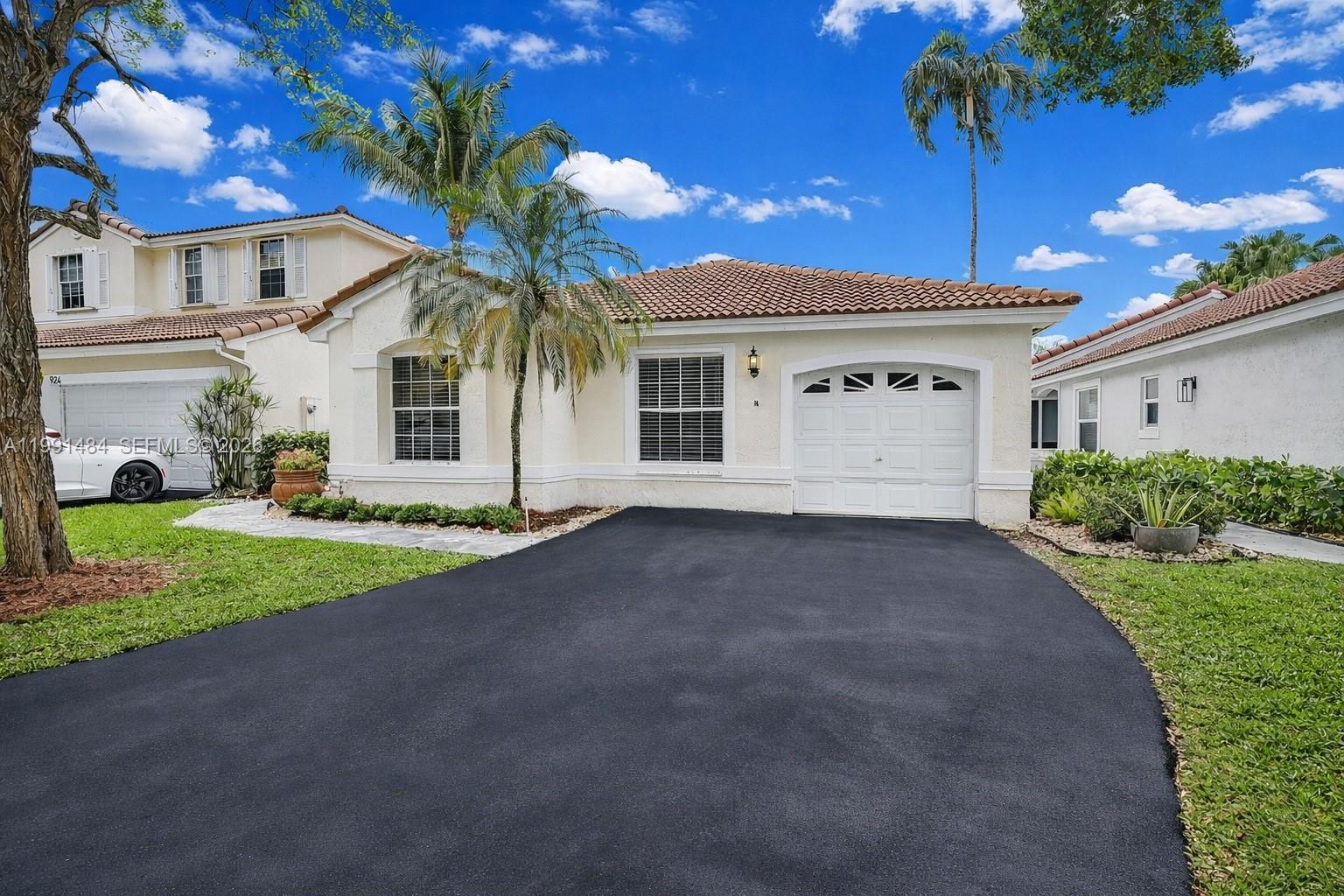 Bright, OPEN FLOOR PLAN, 4-bedroom 2-bath single family, one story home located in a highly sought after gated community in Weston. This home features a NEWER ROOF (2018) and a beautifully remodeled kitchen with popular white shaker cabinets, quartz countertops, & an inviting peninsula with seating—perfect for everyday living and entertaining.
The primary bathroom has been tastefully updated with a modern shower & custom closets, & the home offers ceiling fans throughout. The SPACIOUS DRIVEWAY accommodates up to four cars—more than most homes in the neighborhood. Step outside to a spacious, fenced backyard ideal for family gatherings and outdoor enjoyment.

Conveniently located a very short distance to Weston's Town Center, you’ll enjoy easy access to great restaurants, coffee shops, & shopping. The home is also near A-RATED SCHOOLS, including Tequesta Trace Middle School just a short walk away.

Experience comfortable living in a safe, quiet community—ready for you to make it your own! Sellers are CONTRIBUTING TOWARD BUYERS' closing costs. Open House on Saturday & Sunday, May 30th & 31st, 12:00 PM - 2:00 PM. Call listing agent at the gate.