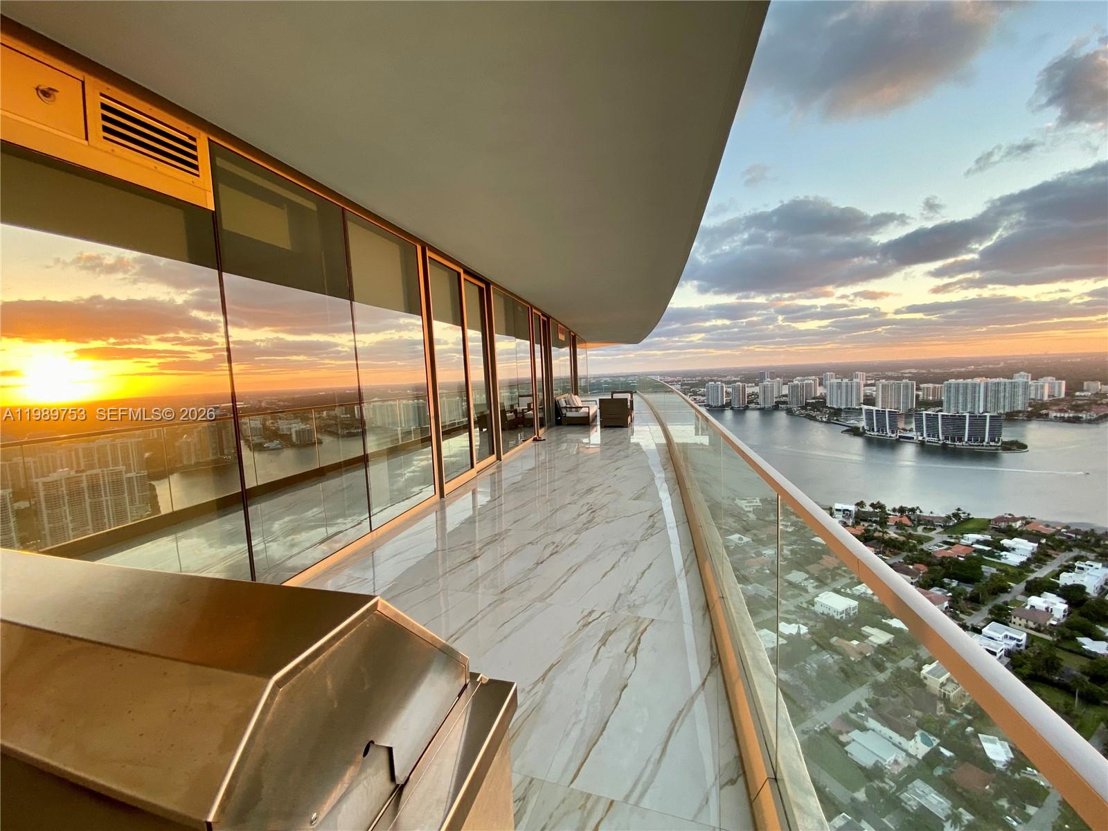 Exclusive Armani residence!! Panoramic breathtaking views from 51st floor corner unit! Stunning views with floor to ceiling windows in every room! Unbeatable sights of ocean, bay and city from oversized 1000sqft wraparound balcony that rivals many penthouses! See it in person to believe it!! Polished porcelain carrara style tile floors, wine cooler, built in coffee maker, bidet toilet, luxurious wolf appliances, and subzero fridge. Armani fitness center with ocean views, 24 hour concierge, free valet parking, direct beach access, 2 hot tubs, private movie theater, heated pool, cigar room, children play area, billiards and card game room, armani spa, private restaurant and bar. These high class amenities for your every need! Fully furnished with luxurious italian furniture! Don't miss it!!!