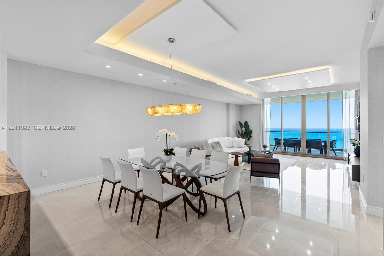 Experience the ultimate in luxury living at The Estates at Acqualina with this elegant Vecchio residence. This stunning 4bd/5bth home with a den/office featuring a custom Murphy bed offers flexibility to serve as an additional bedroom. Actual area per floor plan is 3,287 sq.ft. Enjoy direct ocean and city views, a private elevator foyer, and a sophisticated open layout with designer finishes throughout. Residents indulge in ultra luxury amenities including a private beach, multiple pools, world class spa, fitness center, golf simulator, ice-skating rink, bowling alley, and Rolls Royce house car service. Ideally located minutes from Bal Harbour Shops, Aventura Mall, and both Miami and Fort Lauderdale airports. Live every day like a 5 star resort experience.