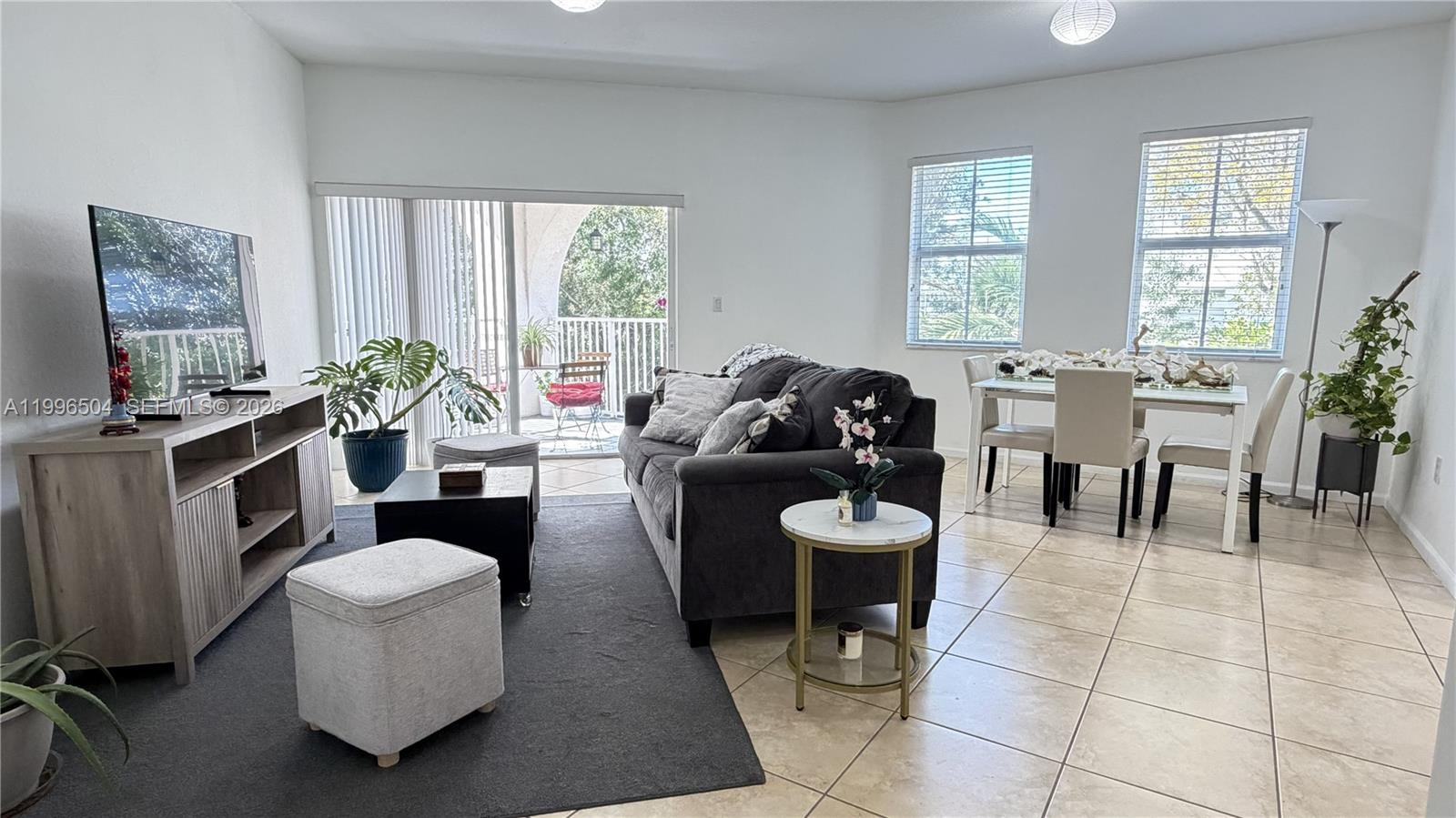 Rare corner unit with the largest floor plan available, offering 3 bedrooms, 2.5 bathrooms, and an additional enclosed flex space perfect for a home office or playroom. This light-filled home offers exceptional privacy, high ceilings, no carpet, spacious bedrooms, generous closets, attic storage, and a large private covered balcony with pea ceful green views. The oversized kitchen features granite countertops, stainless steel appliances, abundant cabinetry, and ample counter space, plus a separate laundry room. Enjoy resort-style amenities including clubhouse, pool, sports courts, walking paths, visitor parking, 2 parking spaces. Close to Dr Toni Bilbao Elementary School. Excellent location with quick access to the Florida Turnpike, shopping, dining, and everyday conveniences. If you are looking for size, functionality, and privacy, this is the one.