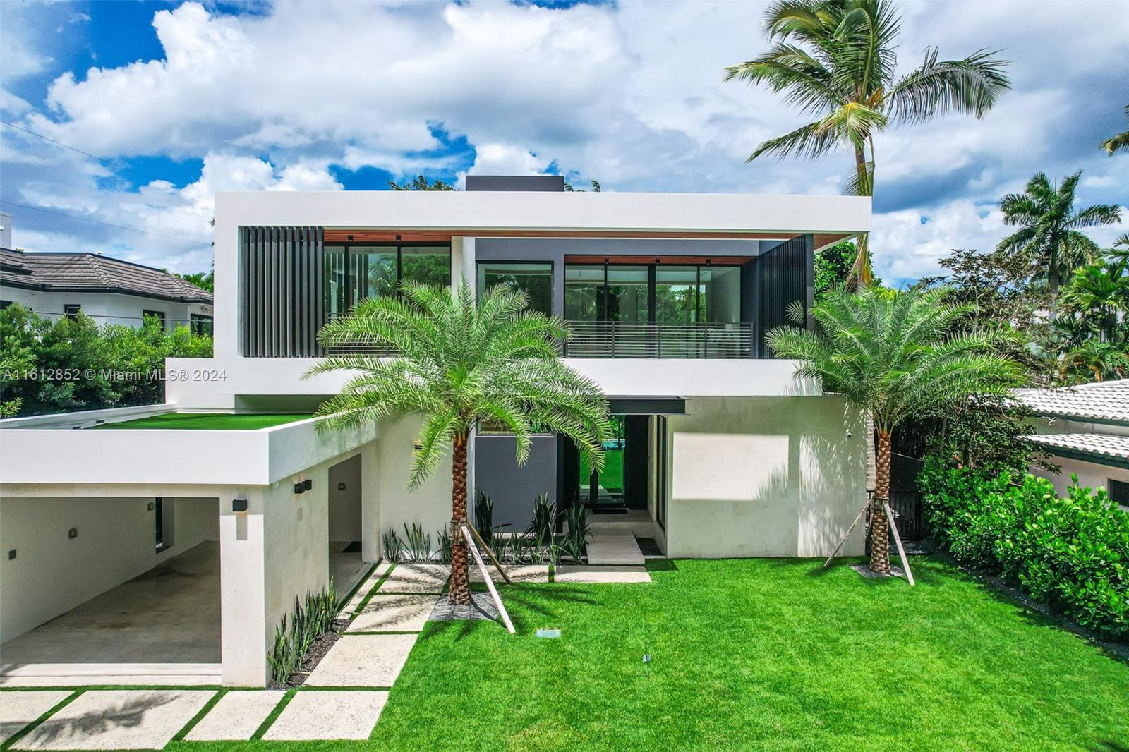 Welcome to your dream home in the heart of Coconut Grove, steps away from top-rated schools, popular local hotspots, serene bayfront parks, and marinas. Boasting almost 5,800 total sf, this expansive home provides ample space with 5 bedrooms and 5.5 bathrooms. This magnificent residence offers exquisite design and top-of-the-line finishes. High ceilings and an open floor plan create an airy and inviting atmosphere, perfect for modern living. The kitchen is a chef’s delight, with gaggenau appliances, storage space, custom cabinetry, and a cooking island. The large master suite is a true retreat, featuring a luxurious en-suite bathroom, a beautiful walk-in closet, and an expansive terrace. Step outside to your private tropical oasis, with a large pool and a beautifully landscaped outdoor.