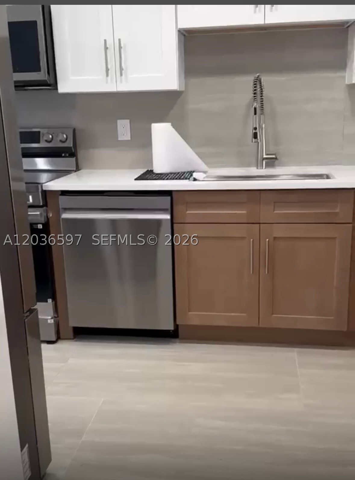 completely remodeled unit. Beautifully remodeled unit featuring modern finishes throughout. This turnkey home offers brand-new kitchen with updated cabinetry, quartz countertops and stainless-steel appliances. Renovated bathrooms, new flooring, fresh paint, upgraded lighting and fixtures. The property has been redesigned to provide a bright, contemporary living space with excellent functionality and comfort. Move-in ready and conveniently located easy access to turnpike and I95. Palm Air condo counts with multiple pools to access, patrol security and other amenities. Call listing agent today.