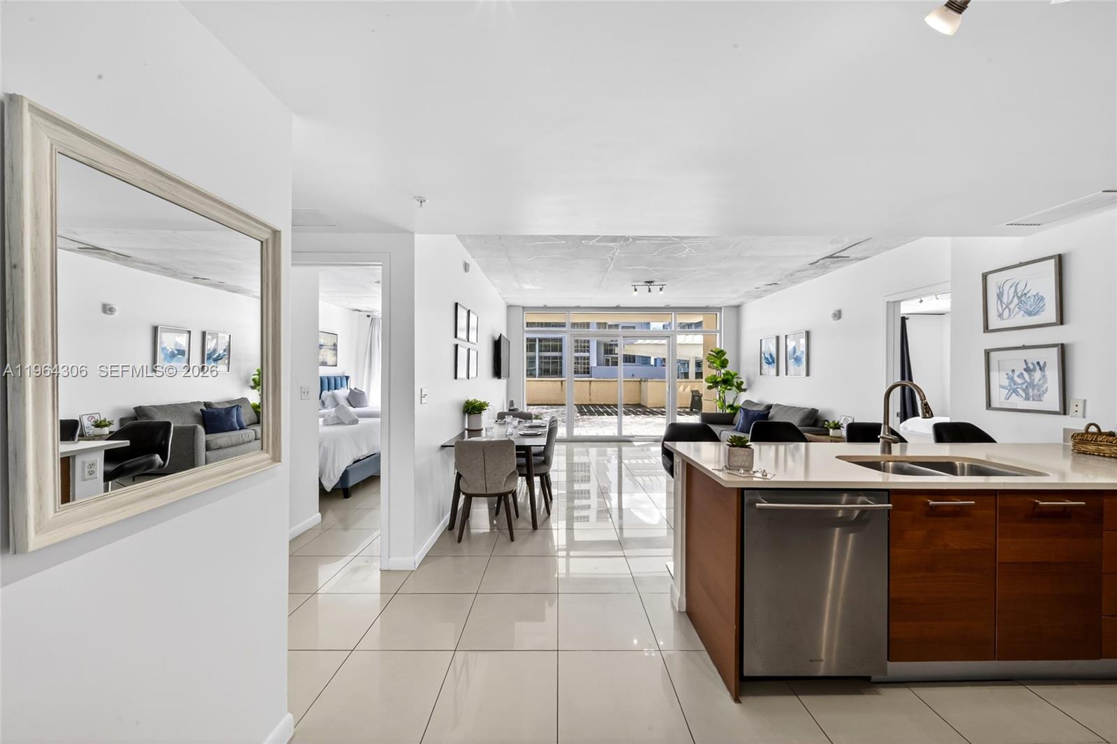 Welcome to your Airbnb approved oasis in the middle of the hottest Midtown neighborhood in the city. Unique private terrace with almost 1,000 square feet  entertaining space . Only 2 units in the building have this! Generous interior features like a huge primary walk in closet, large kitchen and even a secure Owner's Closet to lock your valuables should you choose to Airbnb the condo make this the perfect home away from home. Plus you are in Midtown with Trader Joe's across the street, Target, restaurants, bars, Barry's and so much more right outside your door. The building also has full amenities like pool and gym.