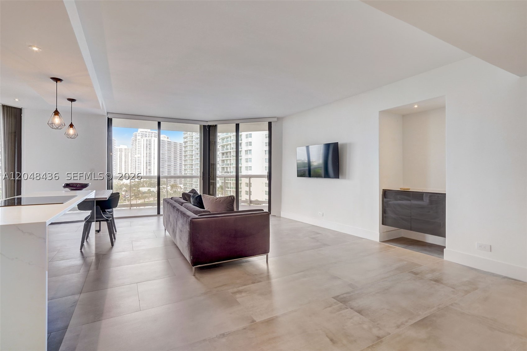 Spectacular Fully Remodeled 2-Bedroom, 2-Bath Condo with Panoramic Water, Golf & City Views: Seller Pays Special Assessment! Welcome to the finest 2/2 residence in the building. This stunningly remodeled condo delivers luxury living at its best, showcasing sweeping views of shimmering water, lush golf greens, and the vibrant city skyline. Bathed in natural light, the open-concept layout is enhanced by premium finishes and thoughtful design throughout. The chef-inspired kitchen is a true showpiece, featuring top-of-the-line appliances, custom cabinetry, and sleek surfaces; perfect for both everyday living and entertaining. Expansive living and dining areas flow effortlessly, creating a refined yet inviting atmosphere. Retreat to spacious bedrooms offering custom closets and spa-inspired bathrooms designed for comfort and relaxation. Every detail has been meticulously curated to blend modern elegance, functionality, and timeless style. Unwind with breathtaking sunsets and sparkling city lights from your private sanctuary. Ideally located near houses of worship, upscale shopping, and A-rated schools, this move-in-ready home is an exceptional opportunity to enjoy luxury, location, and valueu2014all in one remarkable residence.