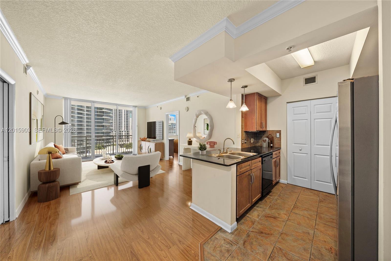 A two-bedroom, two-bath residence at Cité with Biscayne Bay views from every room, a private balcony, and one of Edgewater's most walkable addresses. The open layout brings in natural light and offers a living and dining area generous enough to comfortably fit a 6-person dining table. Wood laminate flooring flows throughout, and the primary bedroom features a walk-in closet, while the primary bath boasts a double sink. Additional highlights include generous closet space, an in-unit washer and dryer, and one parking space. Strong value for the location, the views, and the building.
Cité residents enjoy premium building amenities including valet, concierge, a fitness center, pool and jacuzzi, business center, and a club room with billiards. The building sits directly across from Margaret Pace Park, with walking paths, soccer fields, and tennis, basketball, and volleyball courts. Publix, Whole Foods, the Miami Trolley, restaurants, shops, museums, concerts, and top charter schools are all minutes away, with quick access to the highways, the airport, and the beaches.