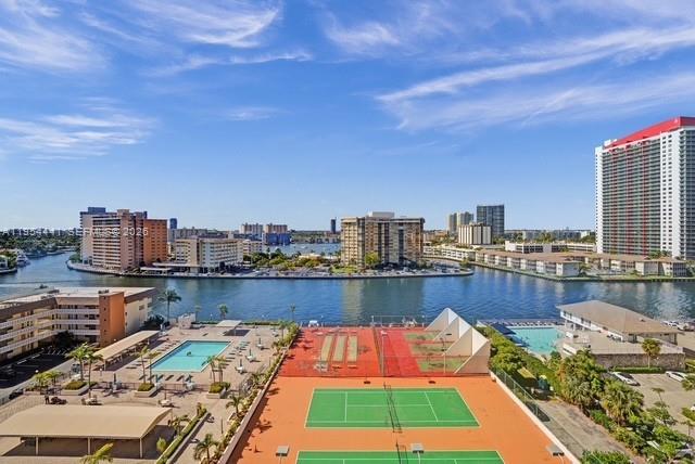 Spacious corner 1300 SQ. FT. 1BD/2BA (MASTER BEDROOM HAS BEEN DIVIDED TO CREATE A SMALL SECOND BEDROOM) at the Prince George in Hallandale Beach, just across from the ocean and city park. Rarely available line and best price in the building!  This high-floor  moderately updated residence offers Intracoastal views from a large balcony with yacht access.  marble bathroom, utility closet, and plenty of storage. The building offers great amenities including a heated pool, gym, tennis court, BBQ area, 24-hour concierge. Closest unit to Laundry and storage on the same floor. Water and cable included in HOA. Steps to the beach, shops, and dining. 1 parking space #276.