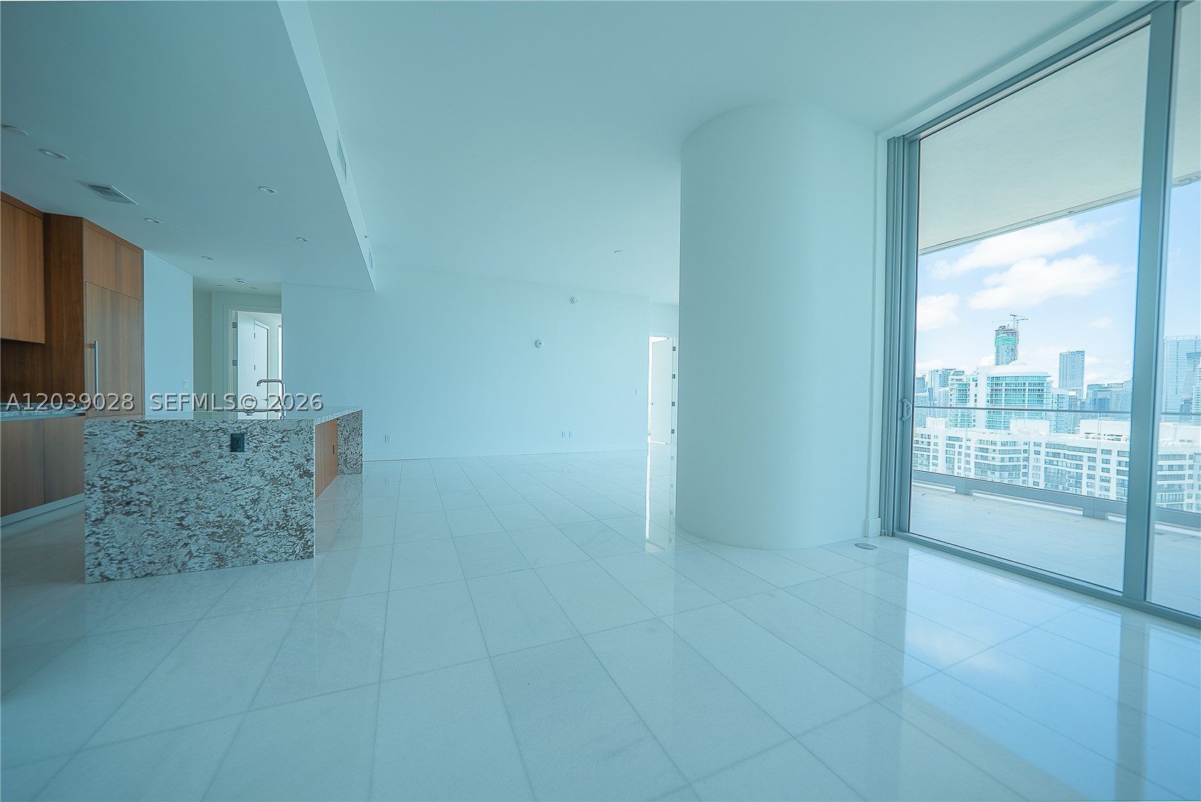 Set on the 27th floor of UNA Residences, this brand-new three-bedroom, three-and-a-half-bath home reimagines waterfront living in Brickell. Walls of floor-to-ceiling glass frame sweeping southeast exposures across Biscayne Bay, Coconut Grove, and the open horizon, drawing natural light deep into the open-concept interior. Marble flooring runs throughout, complementing a kitchen outfitted with premium Gaggenau appliances. Living and dining areas open onto an expansive terrace, dissolving the boundary between indoors and out — as suited to a quiet morning coffee as to an evening of entertaining. Residents of this architecturally distinctive tower enjoy a curated amenity collection anchored by three resort-style pools, a state-of-the-art fitness center, and a spa concept envisioned by the chairman of Aman. Privately positioned within an exclusive Brickell enclave, UNA offers a rare sense of calm and seclusion while keeping the energy of Brickell, Coconut Grove, Downtown Miami, and the beaches of Key Biscayne within easy reach.