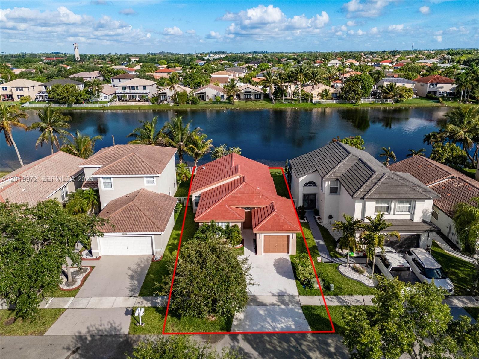 Welcome to your new home in the highly sought after Sapphire community of Silver Lakes in Miramar! This well maintained single-family residence features 3 bedrooms, 2 bathrooms, and a 1-car garage with newly resurfaced flooring. Enjoy peace of mind with a brand-new roof and take in serene lake views from your own backyard oasis.  Beautiful landscaping.  Located in a gated community offering resort-style amenities including a clubhouse and pool, this home is perfect for buyers seeking comfort, security, and an exceptional lifestyle. Situated within an excellent school district and conveniently close to shopping, parks, hospitals, and major highways, this home truly has it all.  Whether you’re a first-time buyer, growing family, or simply searching for the perfect place to call home, this Silver Lakes gem is a must-see!