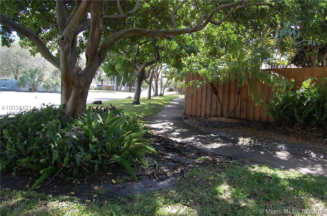 Corner lot, mature landscaping,  private fenced Garden of Eden, w/lots  outdoor areas,  park-like setting surrounds this house, w/ meandering pathways, fountain, gorgeous upgraded pool finish, plenty of patio. Large front porch, & carport behind privacy fence, (being used as covered porch), music inside and out controlled by your phone, den/media room could be 3rd BR/guest room, W/D, Furnished or Unfurnished. Florida room/dining area faces pool, gardens. Completely updated in 2011. Light Bright Paradise