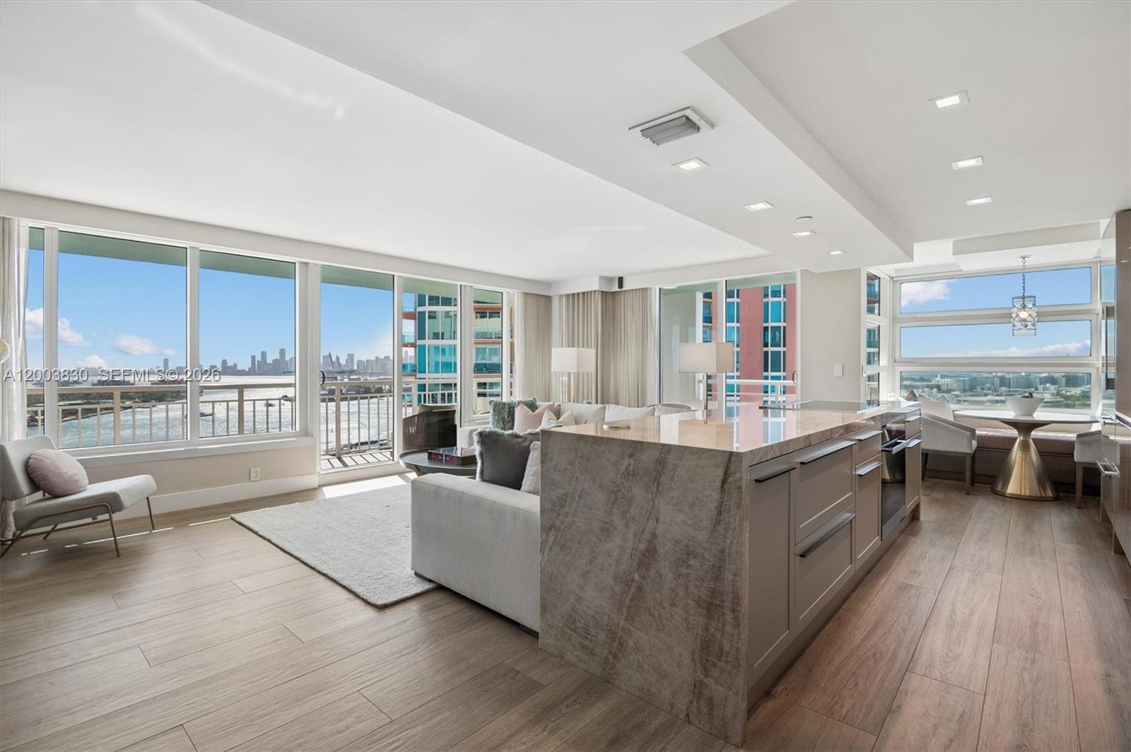 First time on the market, this exceptional 23rd-floor corner residence at South Pointe Towers showcases sweeping views of the ocean, Downtown Miami, and Fisher Island. Fully renovated throughout, it features a Eurocucina kitchen with Sub-Zero and Miele appliances, including a steam oven, along with impact windows, Porcelanosa flooring, custom built-ins, new A/C with UV purifier, updated electrical, and renovated bathrooms. A 370-square-foot wraparound balcony extends the living space and enhances the home’s indoor-outdoor lifestyle. Ideally located in the heart of South of Fifth, this turnkey home places you moments from world-class dining, iconic beaches, beautiful parks, and the best of Miami Beach.