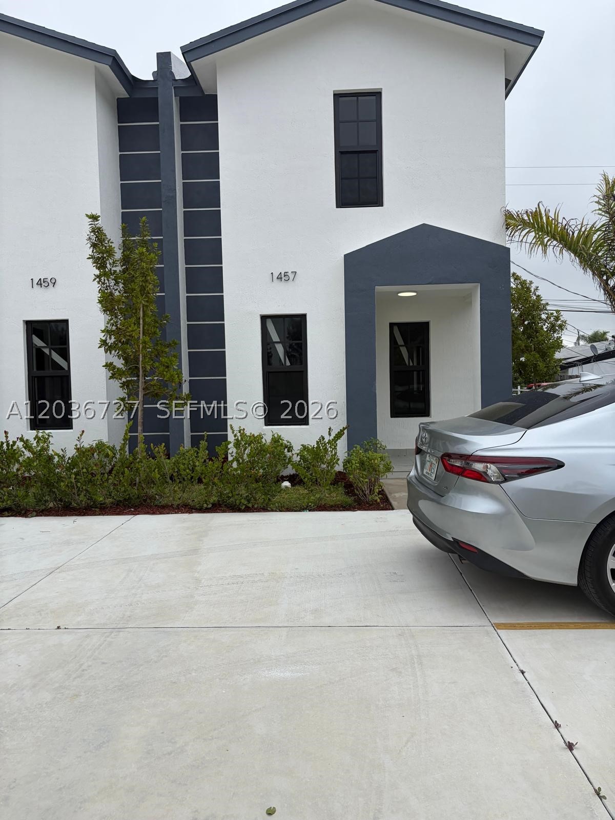 Beautiful newer construction townhome featuring 3 bedrooms and 2.5 bathrooms in a convenient location close to the Florida Turnpike, shopping centers, restaurants, schools, and major highways. This spacious home offers a modern open-concept layout, impact windows and doors, tile flooring throughout the first floor, and no carpet. The kitchen features contemporary cabinetry and ample storage space. The primary suite includes a walk-in closet and private bath. Enjoy the private terrace with additional outdoor storage, plus the convenience of an in-unit washer and dryer. Fast approval process and quick move-in available.  Don't miss this opportunity to live in a well-maintained, move-in-ready home in a highly desirable area.