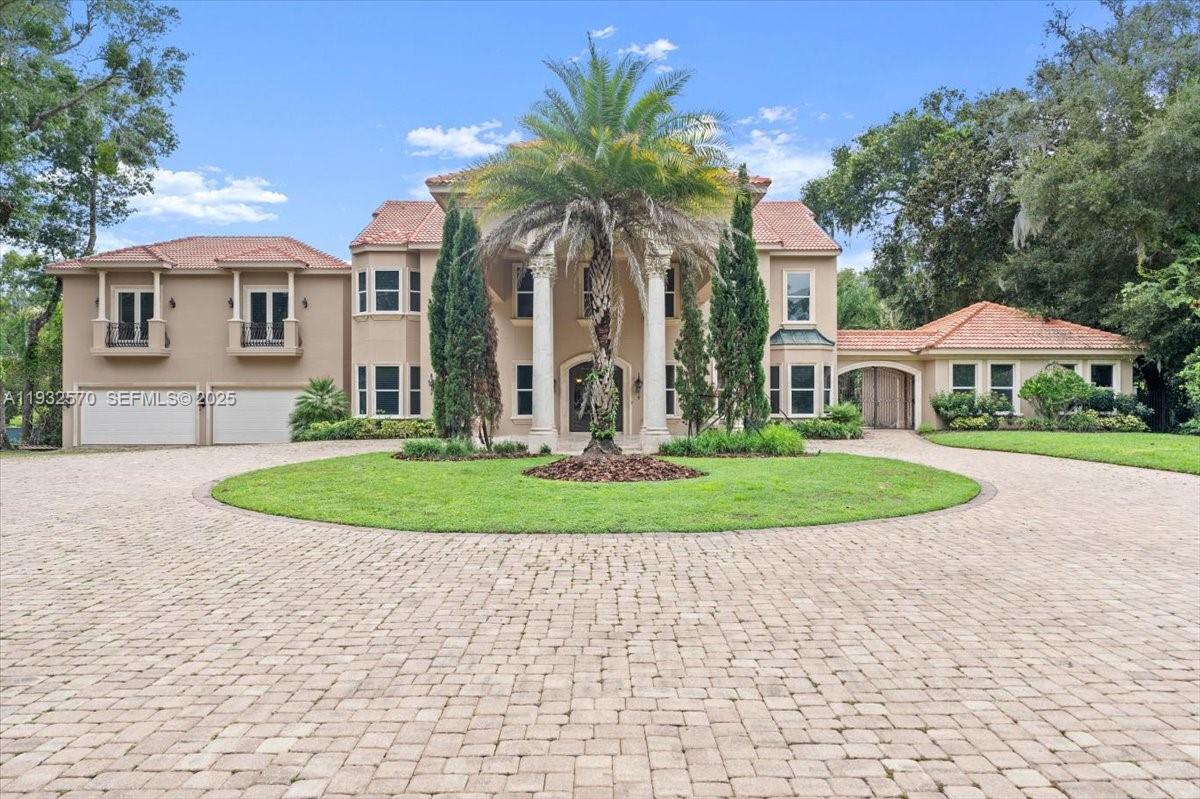 SELLER FINANCING NO CREDIT CHECK , indulge in unparalleled luxury at this breathtaking Mediterranean-style estate, nestled on 2.39 acres of pristine Tomoka Riverfront. Following a meticulous 2007 expansion, this stunning property boasts a masterfully designed main residence, two charming guest quarters, and beautifully landscaped patios, all showcasing serene views. Exquisite custom interiors feature artisan touches and timeless finishes, while the gourmet kitchen is perfect for culinary enthusiasts. Four spacious en-suite bedrooms offer generous walk-in closets and private balconies with tranquil views. The outdoor oasis features travertine porches, patios, and walkways, flowing seamlessly to the sparkling pool area, complete with Italian marble columns and lion fountain. Additional features include a grand port ,