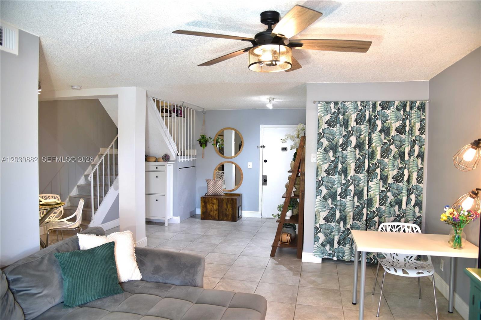 Beautifully maintained 2 bedroom, 1.5 bath condominium located in Village Square Community in Plantation. This unique two-story residence offers open and inviting living area on the main level, featuring tile flooring throughout. A convenient half bath is located downstairs for guest. Enjoy two private balconies with serene views of the community pool. Both spacious bedrooms and full bath with  dual access, allowing entry from the primary bedroom and hallway are conveniently situated upstairs, providing privacy and comfort. Unit includes full size washer and dryer. Ideally situated with easy access to shopping, dining, entertainment, and major roadways, this home offers both comfort and convenience in a prime Plantation location.
