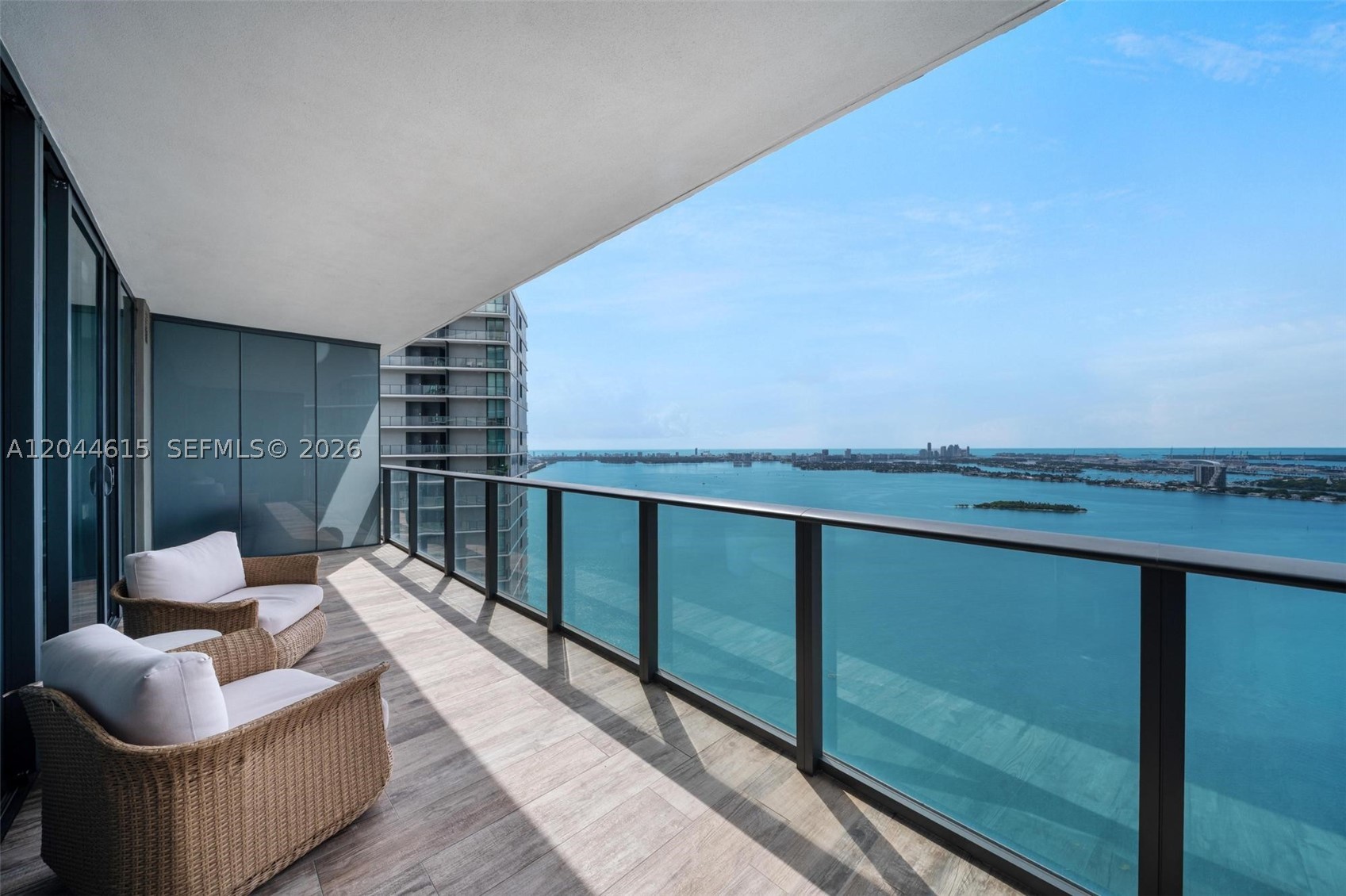 This is one of the finest 2-bedroom residences in the Paraiso District, in one of Edgewater’s most sought-after waterfront enclaves. Beautifully furnished with modern pieces, the unit is in pristine condition and showcases direct bayfront exposure with breathtaking water and city views. The residence offers 2 bedrooms, 3 full bathrooms, a private elevator entry, and an expansive terrace ideal for relaxing or outdoor dining throughout the day. The open-concept kitchen features premium Bosch appliances, including an integrated microwave drawer with push-button opening, Sub-Zero refrigerator & freezer, electric cooktop, fully integrated range hood, wall oven, and dishwasher. Residents enjoy access to exceptional resort-style amenities including a massive heated beach-entry pool with sundecks, towel service, and QR code-enabled poolside food and beverage service. Additional amenities include an outdoor jacuzzi, children’s pool, poolside lounges, BBQ area, complimentary morning coffee, 2 tennis courts, spa with saunas, steam rooms, jacuzzi, heated stone loungers, a fitness center, bowling, game room, resident lounge, library, wine tasting room, cigar lounge, a movie theater and golf simulator. Ideally located, the Paraiso District offers a private, serene waterfront setting just minutes from Midtown, Wynwood, Design District, Whole Foods, and more. Residents also benefit from many free weekly and monthly curated activities organized by management, enhancing the community lifestyle