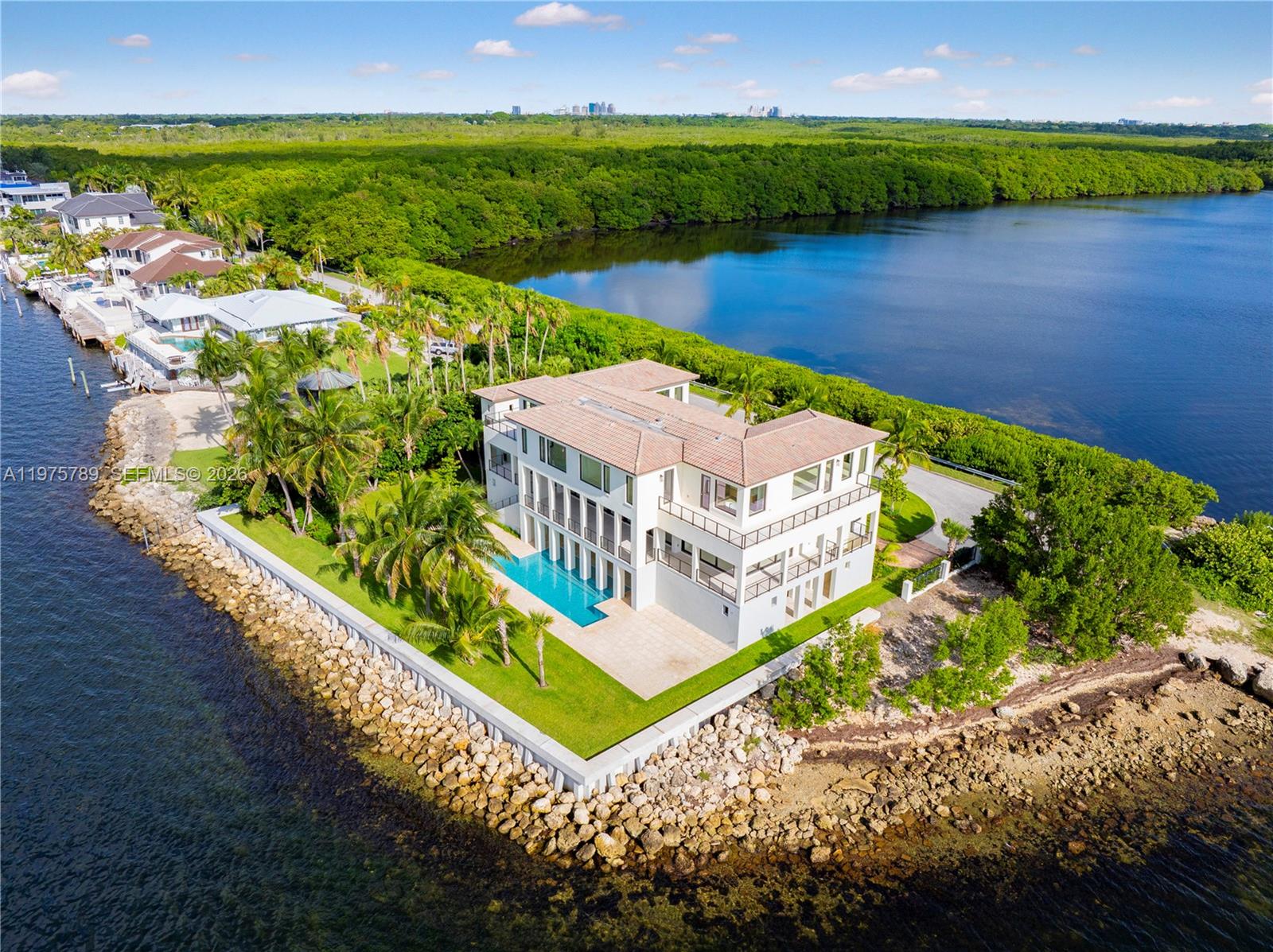 Tip of the World on Lugo Avenue.Gables by the Sea Breathtaking location paired with a stunning contemporary residence. From every room, enjoy unparalleled 360° views framed by floor-to-ceiling impact glass windows & doors. The entrance door itself is a true showpiece, opening into soaring ceilings & a seamless flow of light-filled spaces. Choose your moment: sunrise, sunset ,the sparkling Miami skyline by night.Elevated & elegant, master suite features a spacious balcony overlooking Biscayne Bay. All-new. All-white.Effortless floor plan designed for modern living.The pool deck offers endless water views, complemented by a seawall . Gables by the Sea is a gated community w/Coral Gables Police patrol. 24/7 security. 3D tours, Matterport & videos available. Come see it. Fall in love.