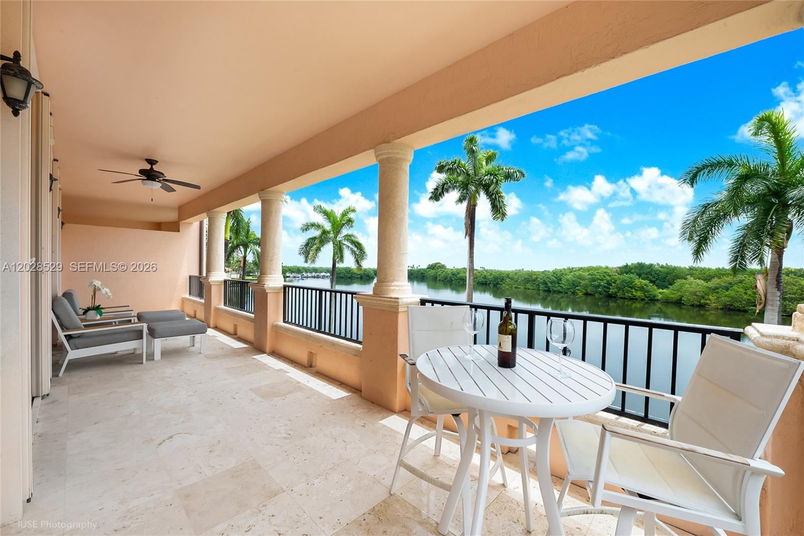 Stunning & rarely available Deering Bay condo with the largest floor-plan available presently in Prestigious Venice East. Breathtaking serene lagoon, marina and Miami skyline views. Private foyer entry leads to spectacular natural light filled grand living and dining room w wet bar and wine station. Continuous massive wrap around balcony surrounds all this plus an expansive cooks kitchen, eat-in garden view breakfast area, a designer open family room ready for fun movie nights w bar counter. Numerous large closets in hallways,  Designer touches throughout this unit with: 4 newly renovated bathrooms, Luxurious primary suite has 2 private baths, office room, closet w built ins, magnificent private patio overlooking lagoon breezy waters with amazing sunrises and evening moonrises. The split plan also accommodates 2 ensuite bedrooms plus a 4th bedroom, plantation shutters, impact glass windows. This high level of condo perfection is hard to find plus the ability to live in a private gated Coral Gables location with A+ schools and great shopping and dining choices. The Deering Bay Yacht and Country Club community offers Optional Golf, Tennis, Marina, and Club Membership sold separately.