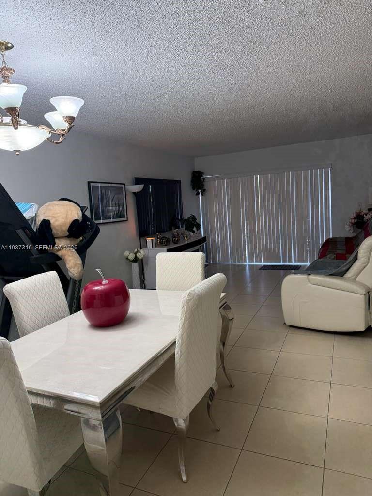 Rare opportunity in Los Arboles Condominium! This spacious 2-bedroom, 2-bathroom second floor unit offers 1,070 sq ft of living area. The property features modern finishes with tile flooring throughout, an updated kitchen with stainless steel appliances, and a bright open living and dining area. Enjoy a private balcony , perfect for relaxing or entertaining. The unit includes two assigned parking spaces, adding extra convenience for owners or tenants. Currently occupied by a long-term excellent tenant, making it a great opportunity for both investors and end users. Ideally located in the heart of Hialeah, close to major highways, shopping, restaurants, and everyday conveniences. WATER is included on the HOA, 40year inspection pass 2023 no assessment & condo have reserve