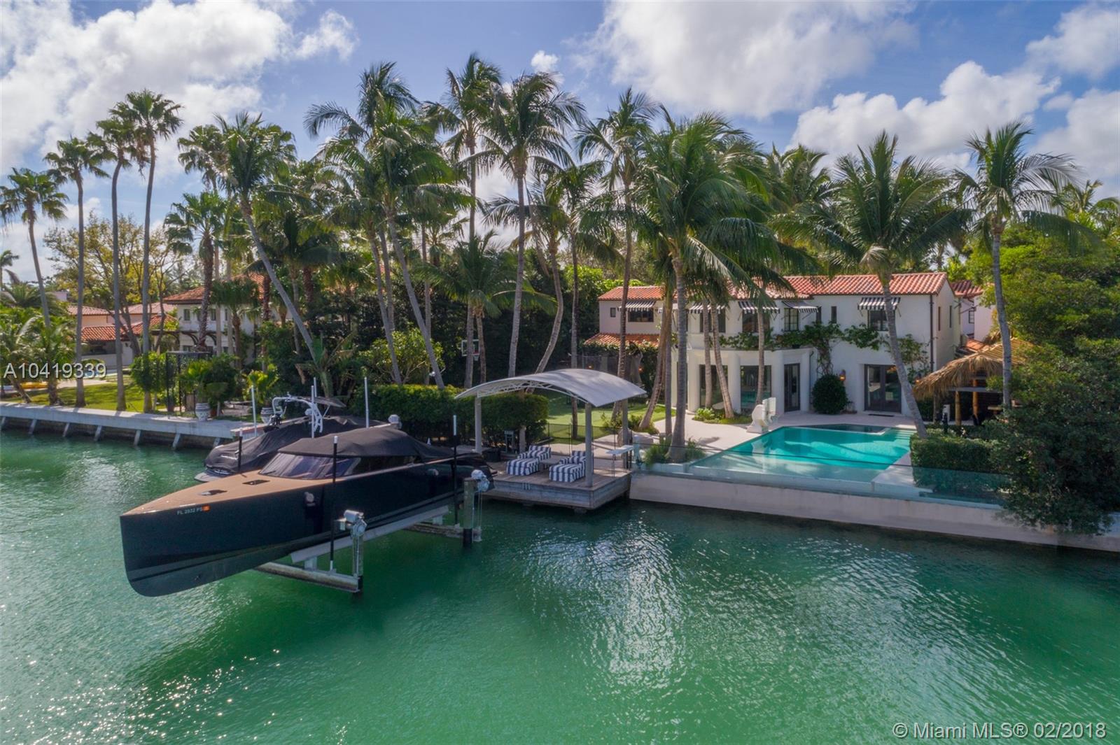 Live a life of luxury in this Mediterranean estate by renowned Miami Beach architect Russell Pancoast, restored by Brodson Construction’s Barry Brodsky. This extraordinary 6,970 SF residence boasts 100’ of waterfront on Indian Creek on more than 20,000 SF. Offering 6BR/5+1BA, this impeccably renovated residence is restored to perfection with luxurious details & exquisite craftsmanship. Enter your gated home through an expansive driveway leading to a lushly landscaped private oasis. Luxurious features include oak wood floors, gourmet kitchen with Viking & Sub Zero kitchen appliances, wine cellar, 1BR guest house with a kitchen, a gate house with full Cybex brand new gym, infinity pool, private boat dock & lift, outdoor cabanas & an expansive backyard.