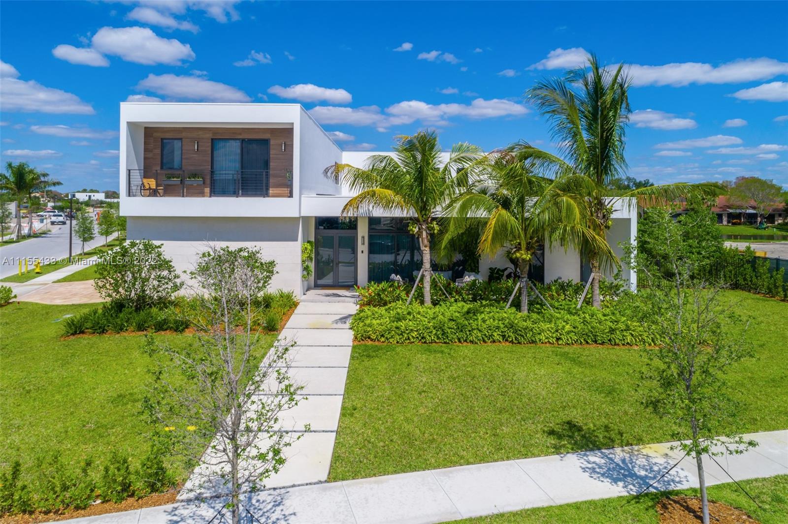 New construction designed by world renown architect Chad Oppenheim. This luxurious house is nestled within the exclusive private enclave of Botaniko Weston. The remarkable 7,552sf masterpiece blends minimalism with environmentally harmonious architecture. This spacious cornered and two story home, open floor plan radiates with natural light, provides 5,293sf of A/C, 5 ensuite bedrooms, 1 studio convertible, 6.5 total bathrooms, media room & staff quarters. Balconies overlooking the sunset and the lake views. Chef-inspired kitchen equipped with Sub-Zero & Wolf appliances, Italian cabinetry and quartz countertops. Escape to your private outdoor oasis, complete with oversized 20x40 pool and summer kitchen and patio. 3 car garage. HOA deposit. A+ schools Minutes to highway access.