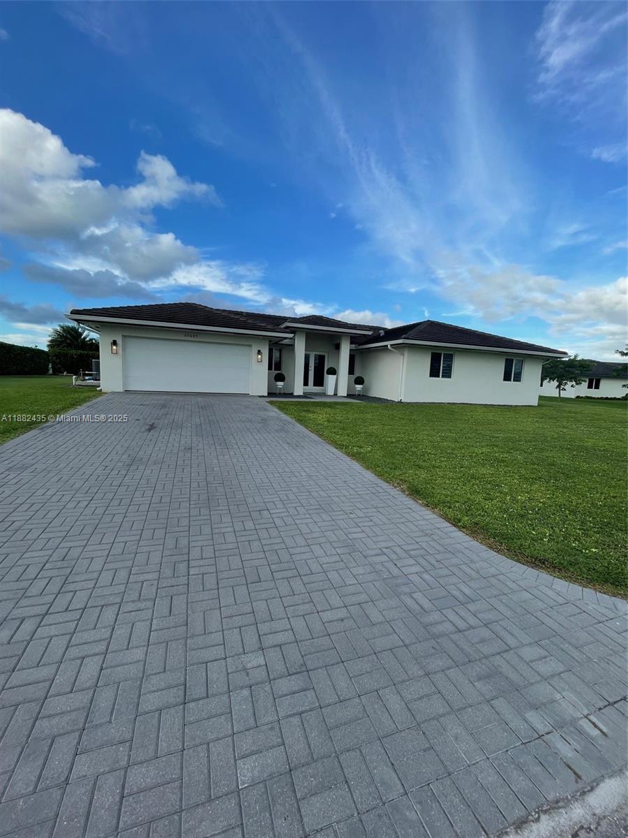 PRICE IMPROVEMENT! 
This is a one of Kind Home! It feel and looks better then a new model Home. House sits on almost a full half acre lot. It's on a quiet Cul-De-Sac. Home has many upgrades. Gutter all aound, Camera Security System, Modern fans. This home is for someone that apprereciates Quality. The floor plan is very well thought out. High quality Cermamic tile throughout. The kitchen is absolutely STUNNING! Quartz counter top as well in the bathrooms. All stainless steel appliances. Step outside and you are in Paradise. A huge pavercovered/Aluminum insulaited patio roof with an outdoor kitchen, BBQ run on gas or charcoal. It even has a Pizza oven/regular oven. A huge shed that can be used for storage or a work shop. Stop looking and make this GEM your home! Will sell fast don't miss the opportunity!